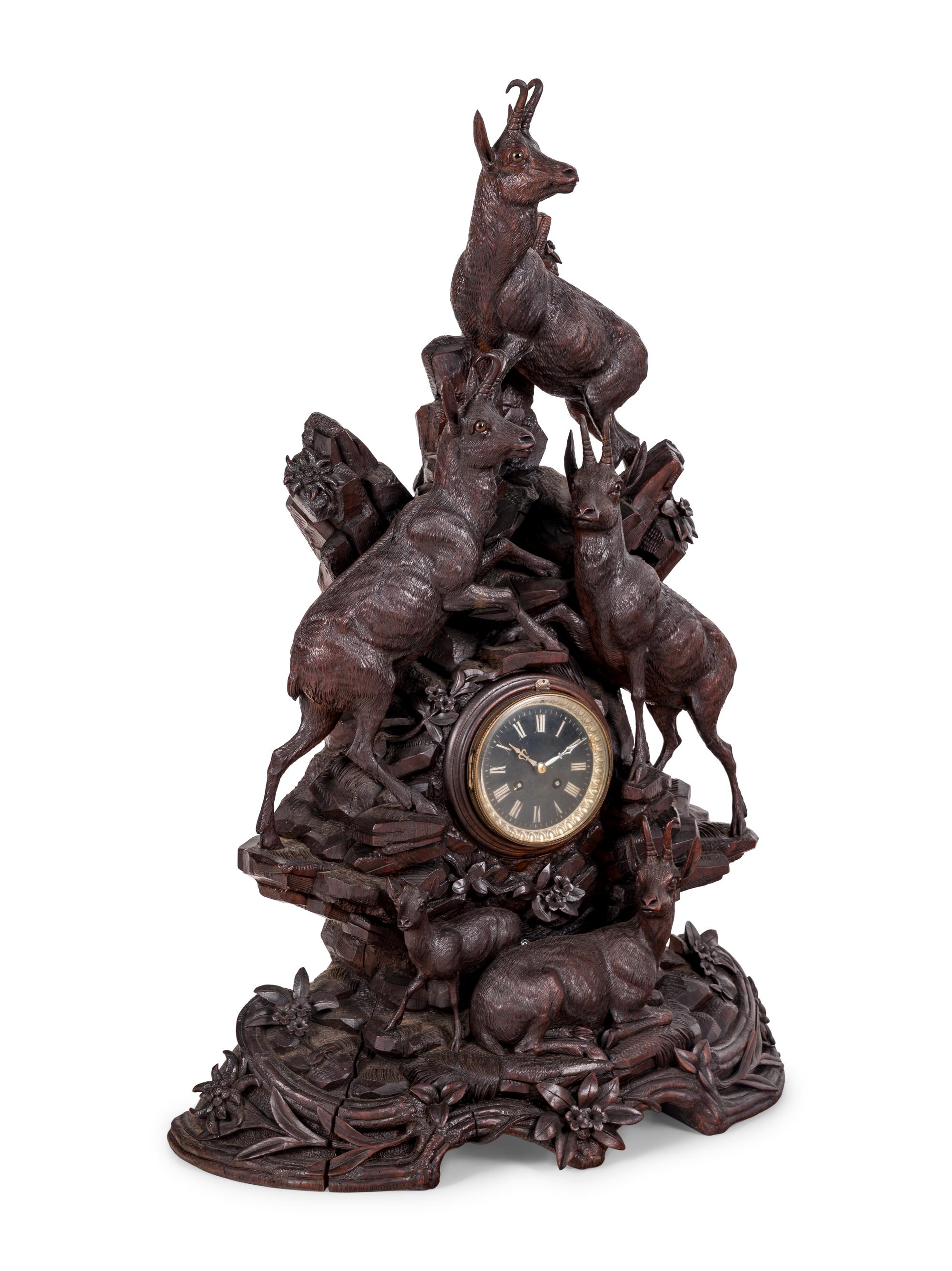 A Black Forest Carved Mantel Clock
