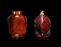 Two Carved Amber Snuff Bottles