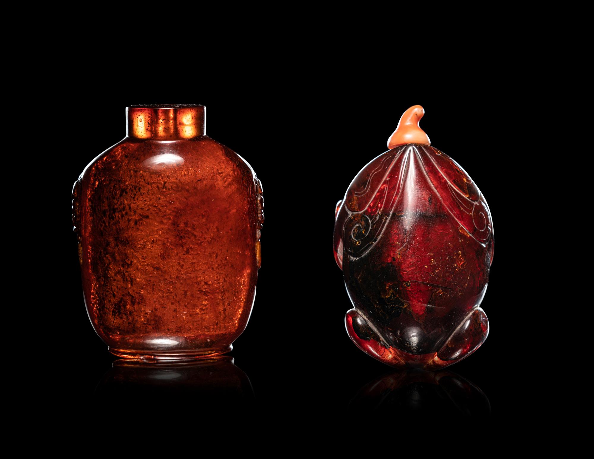 Two Carved Amber Snuff Bottles