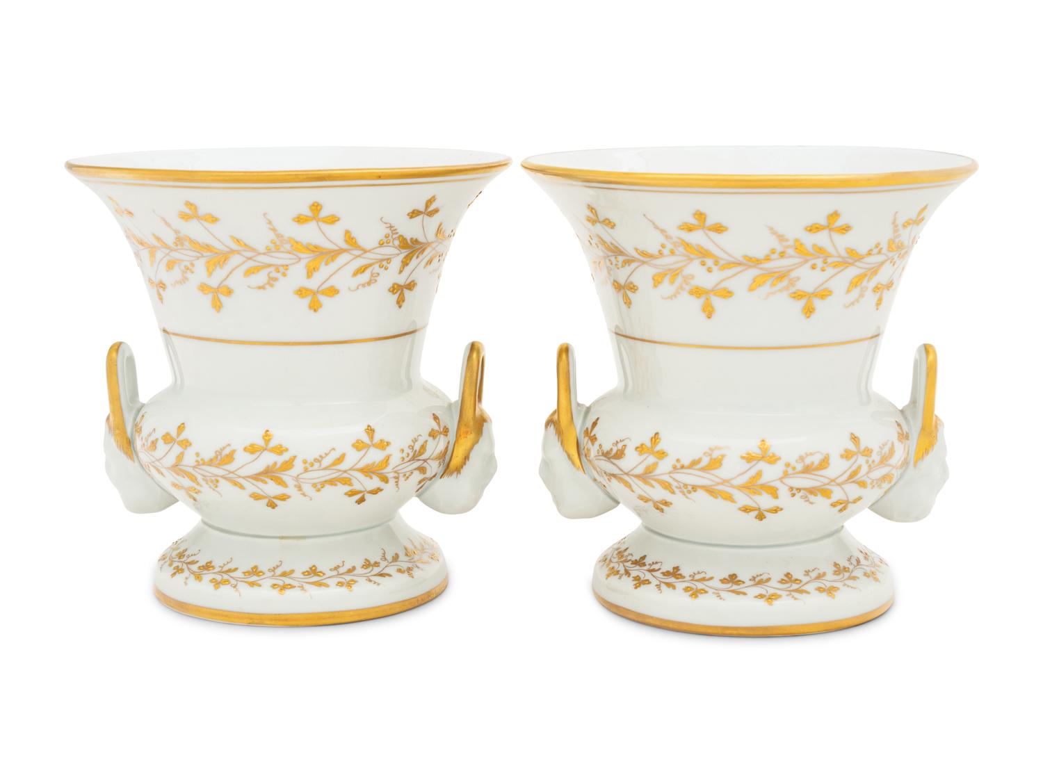 A Pair of French Parcel Gilt Porcelain Campagna Urns