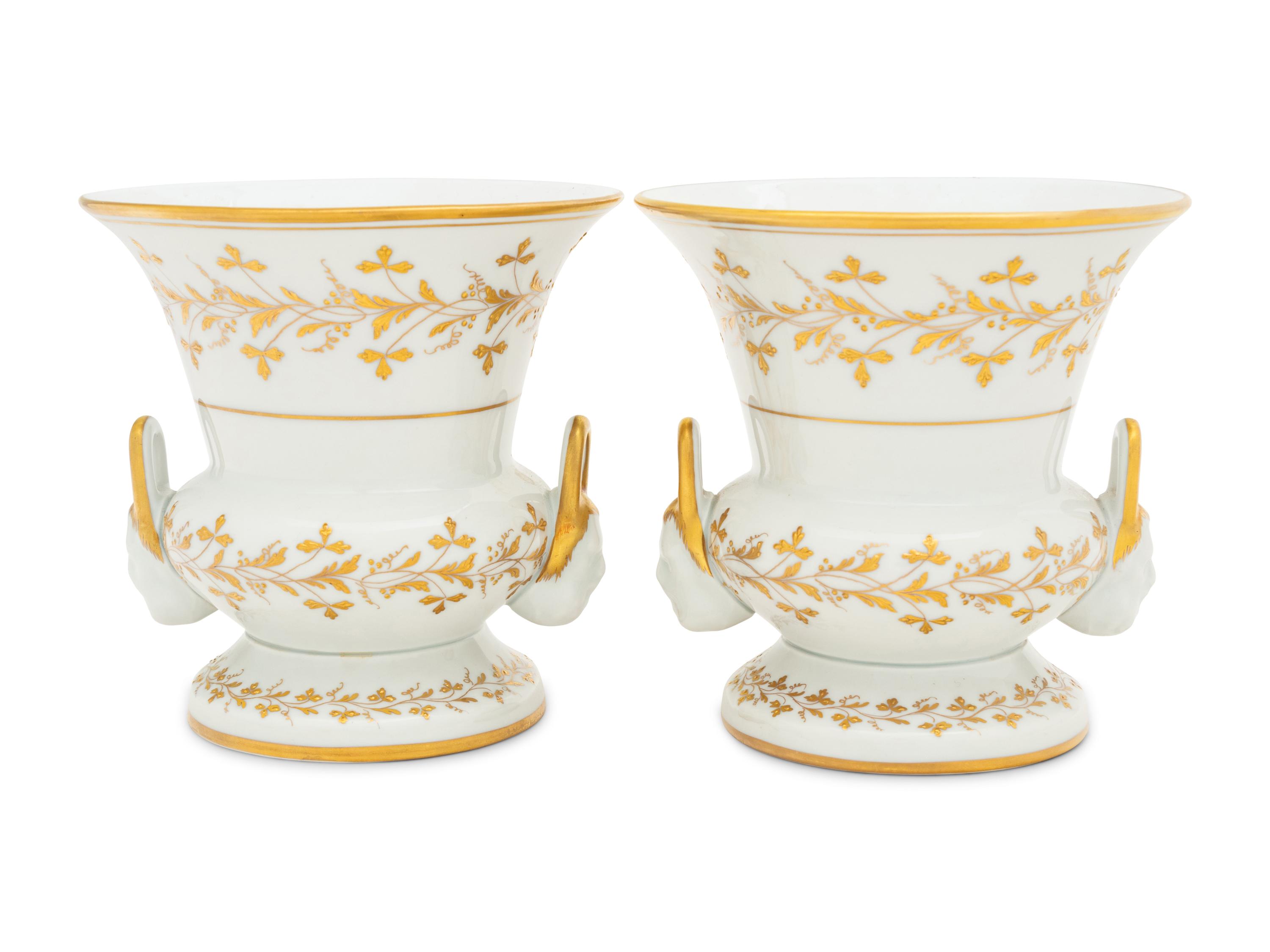 A Pair of French Parcel Gilt Porcelain Campagna Urns