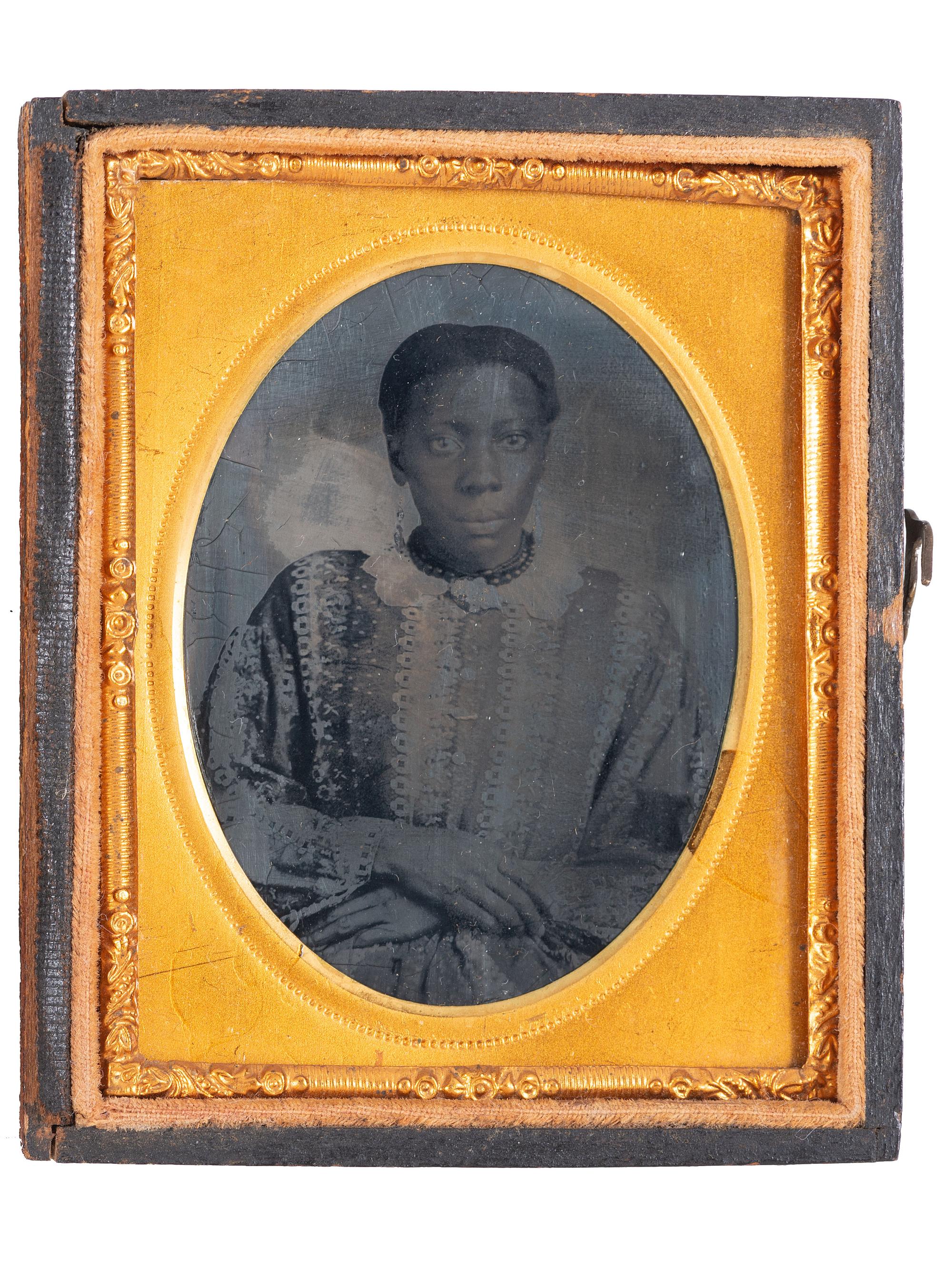 [EARLY PHOTOGRAPHY]. A pair of ninth plate tintypes of African American women.