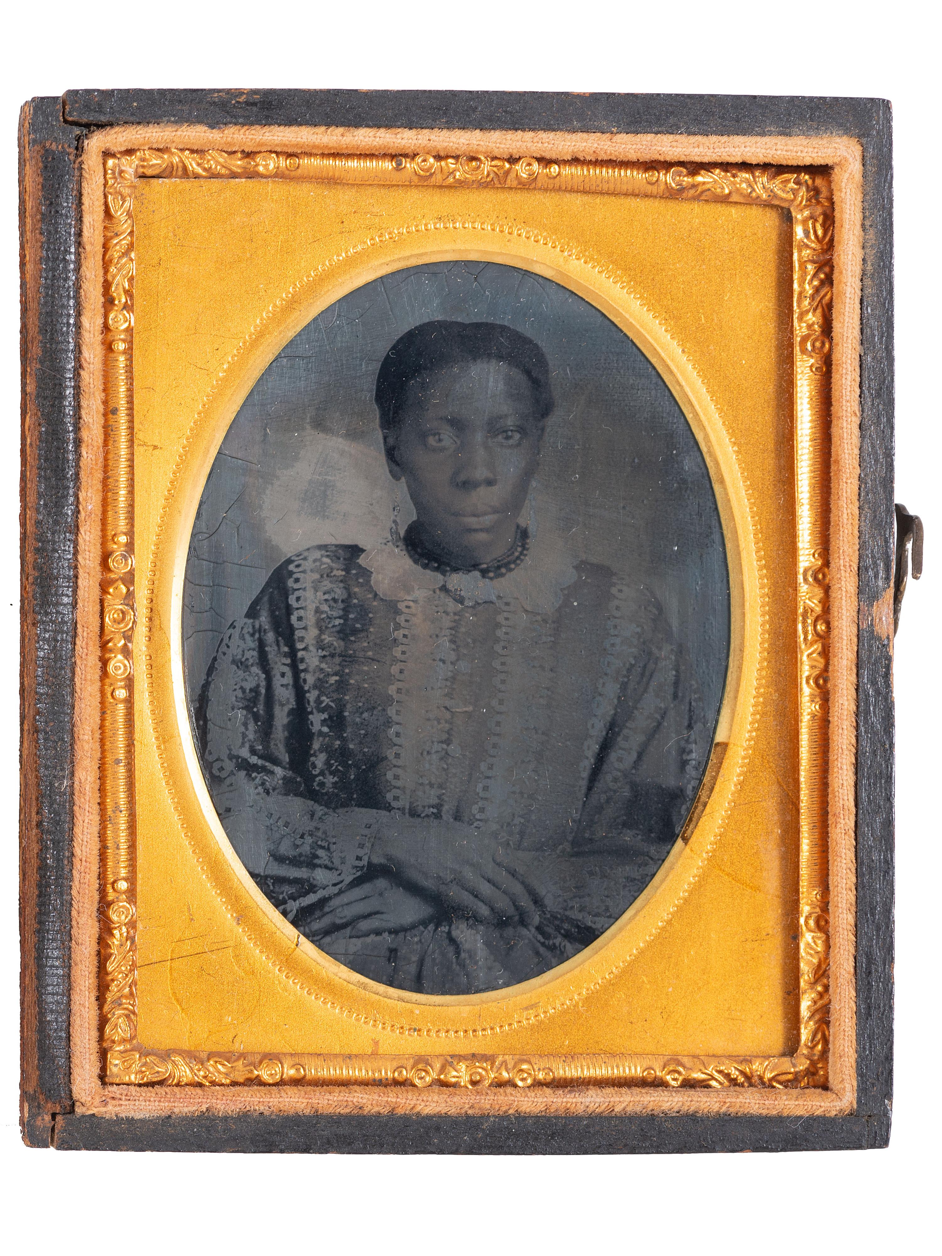[EARLY PHOTOGRAPHY]. A pair of ninth plate tintypes of African American women.