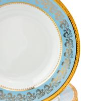 A Set of Eight Limoges Porcelain Soup Plates
