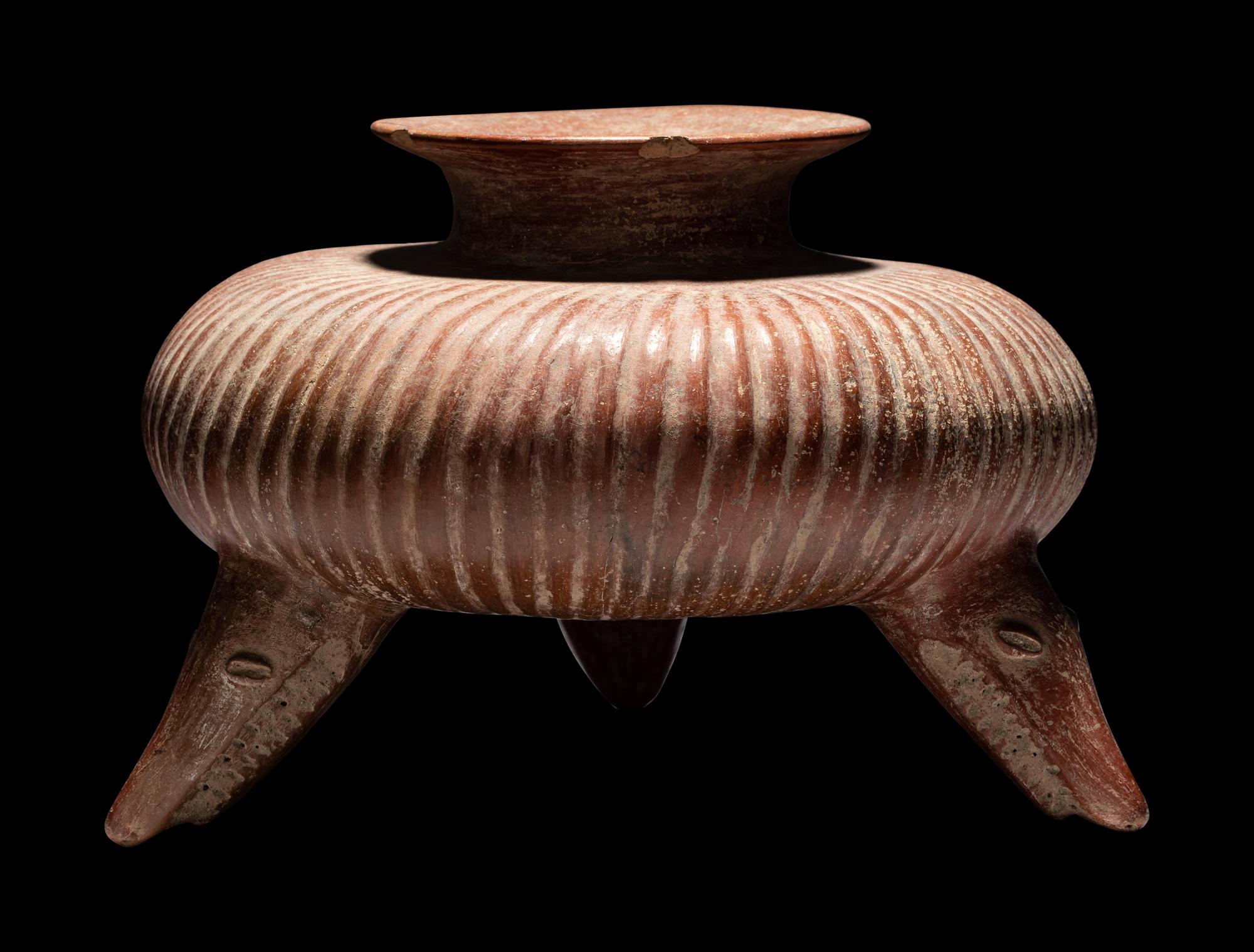 A Colima Gadrooned Vessel with Shark Feet