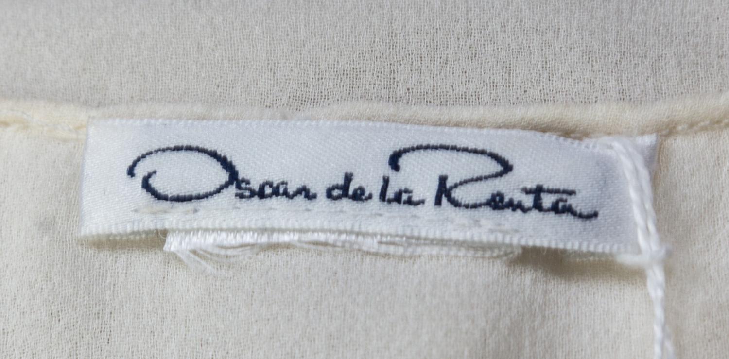 An Oscar de la Renta Cream Silk Blouse,