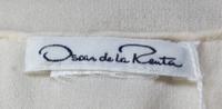 An Oscar de la Renta Cream Silk Blouse,