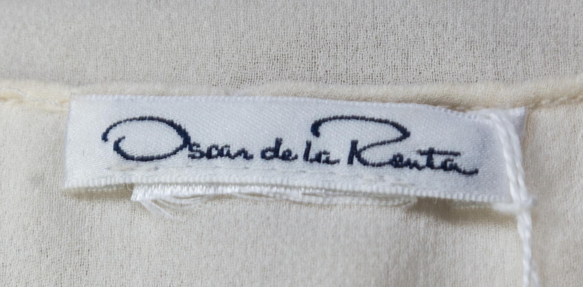 An Oscar de la Renta Cream Silk Blouse,