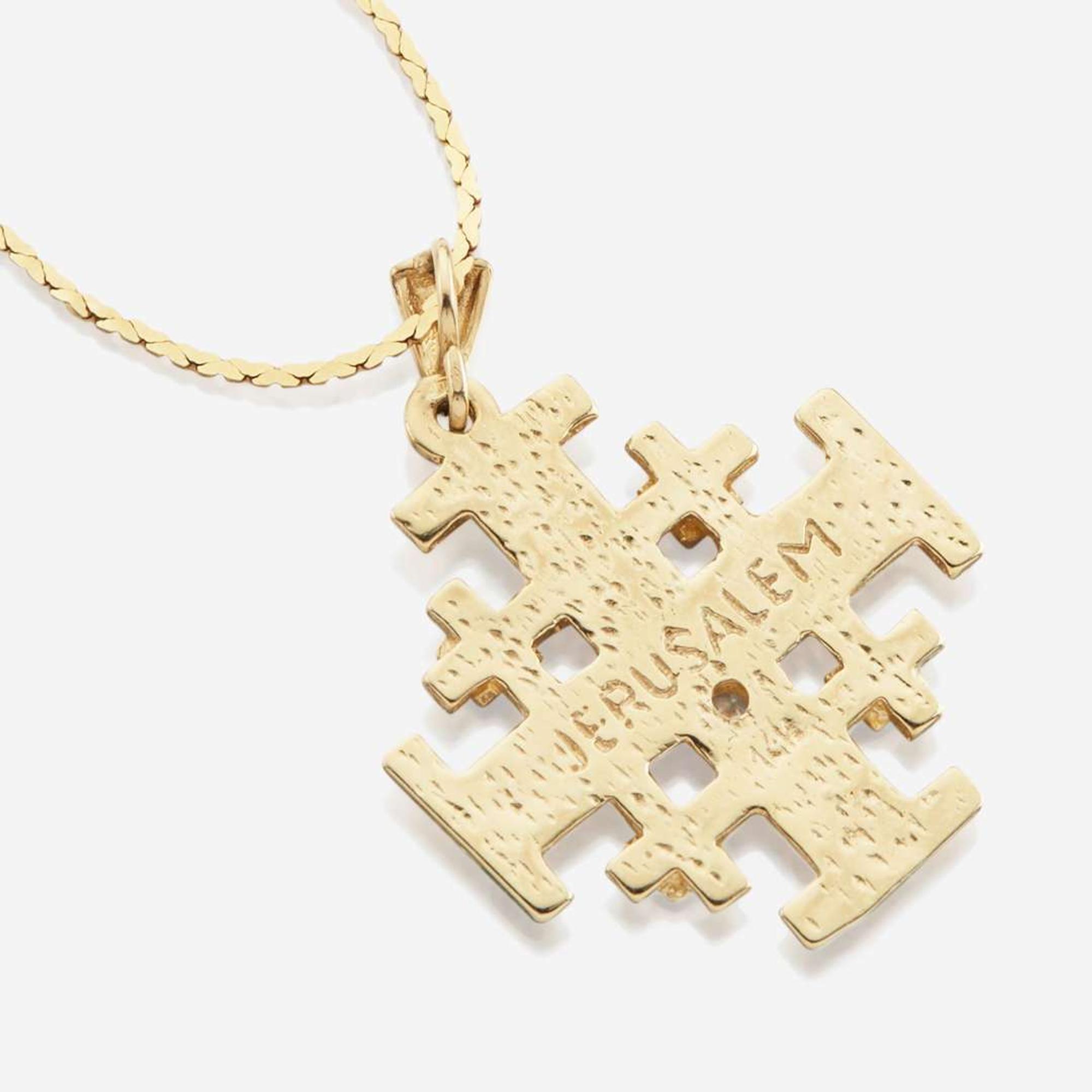 A collection of four gold necklaces