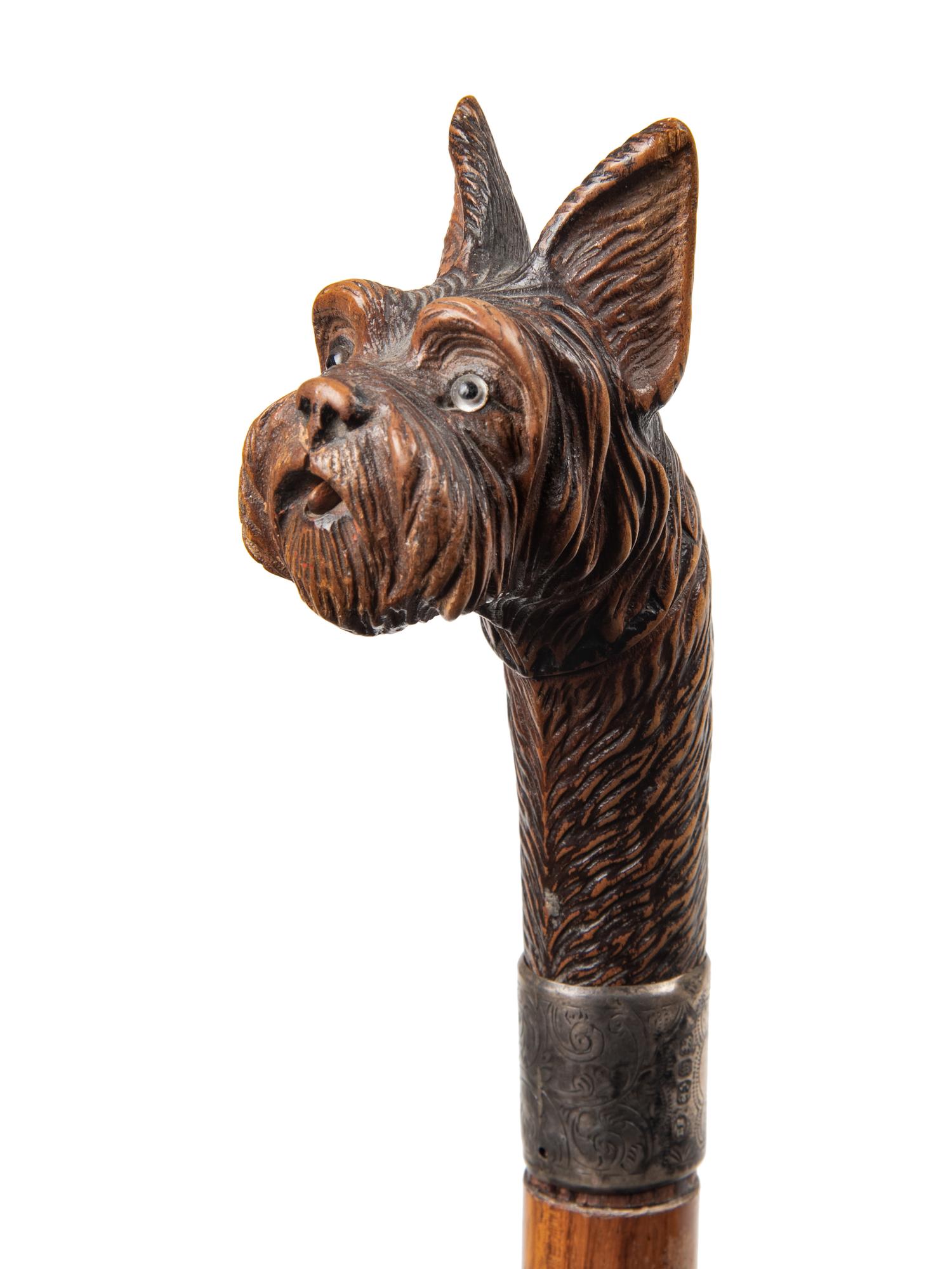 Two English Glass-Inset Carved Wood Dog's Head Canes