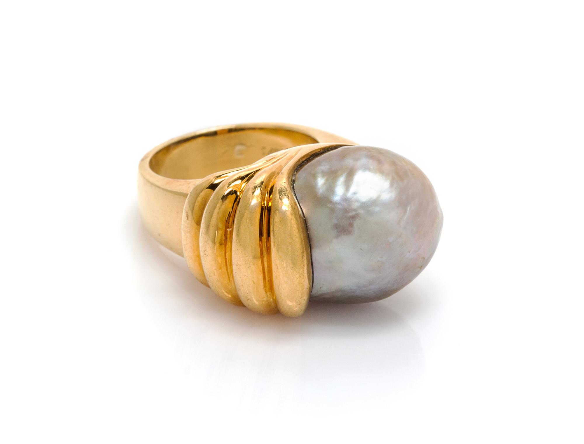 An 18 Karat Yellow Gold and Cultured Pearl Ring, Gump's, 16.30 dwts.