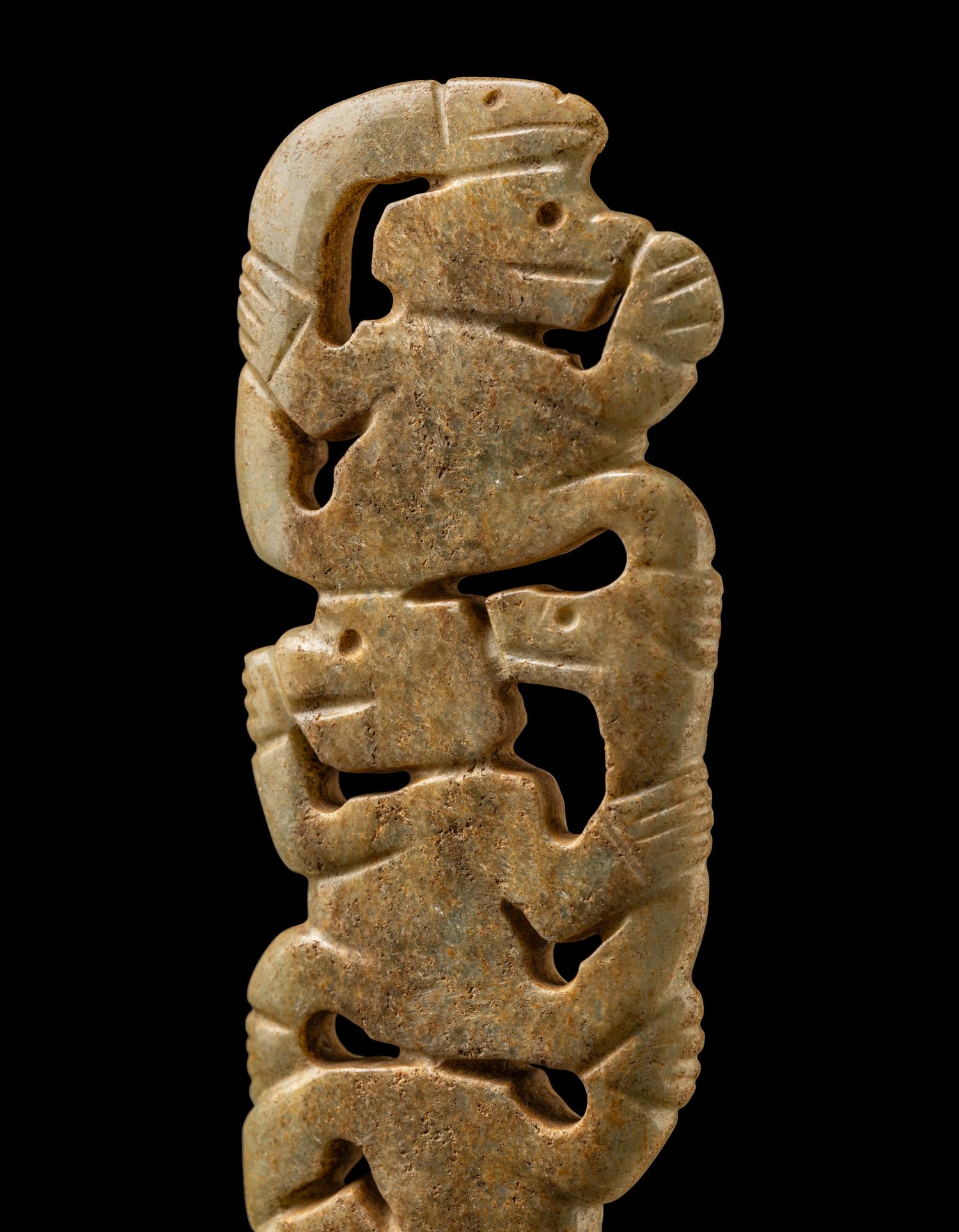 A Costa Rican White-Jade Snake and Monkey Pendant