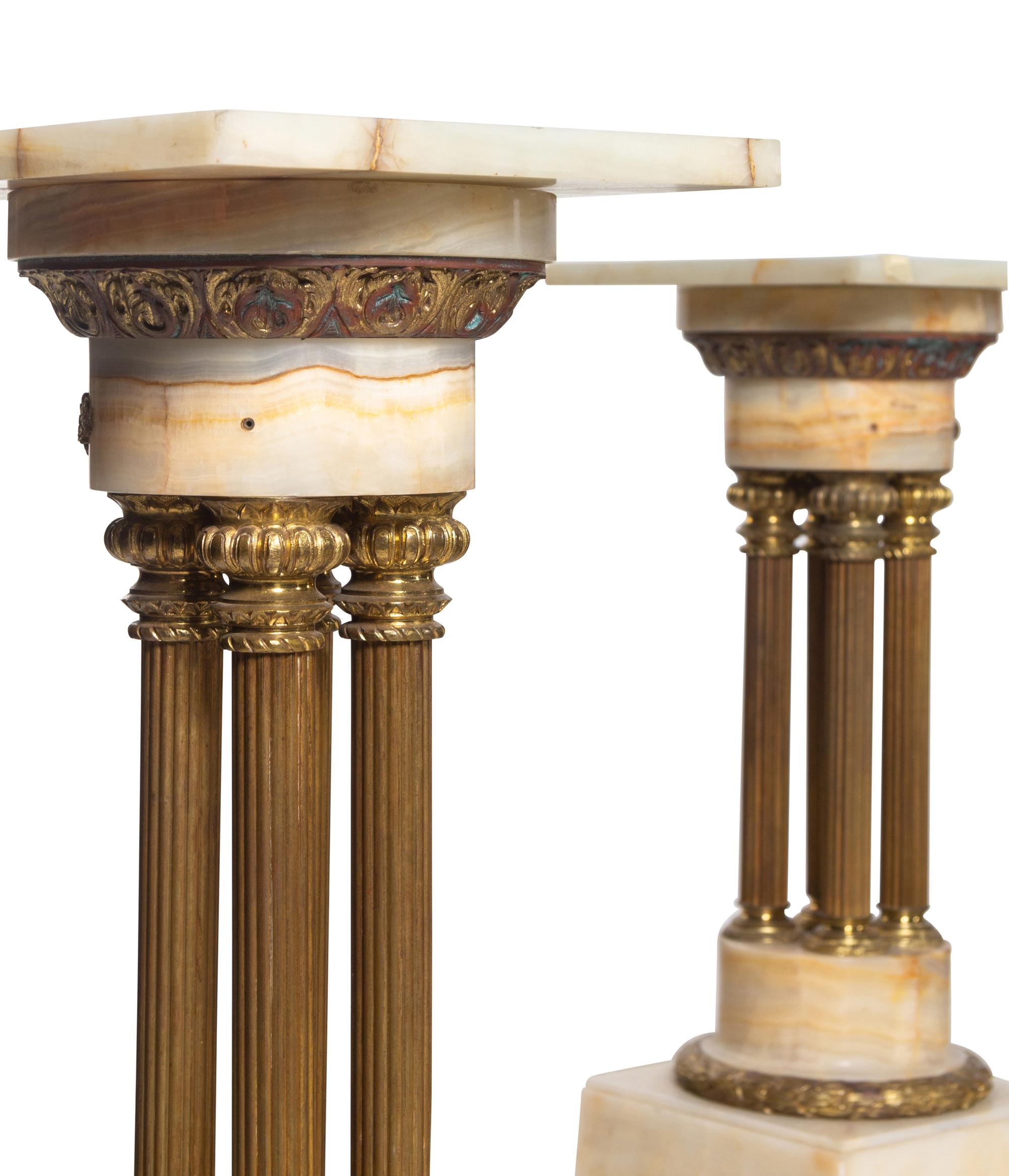 A Pair of Continental Gilt Bronze Mounted Onyx Pedestals