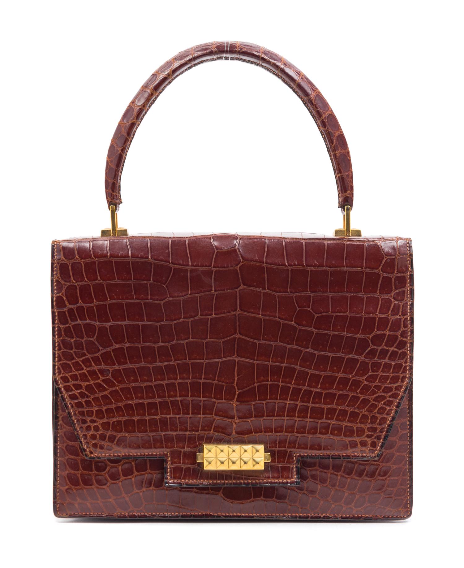 An Hermes Brown Crocodile Handbag, 9.5" x 7.5" x 1.5".