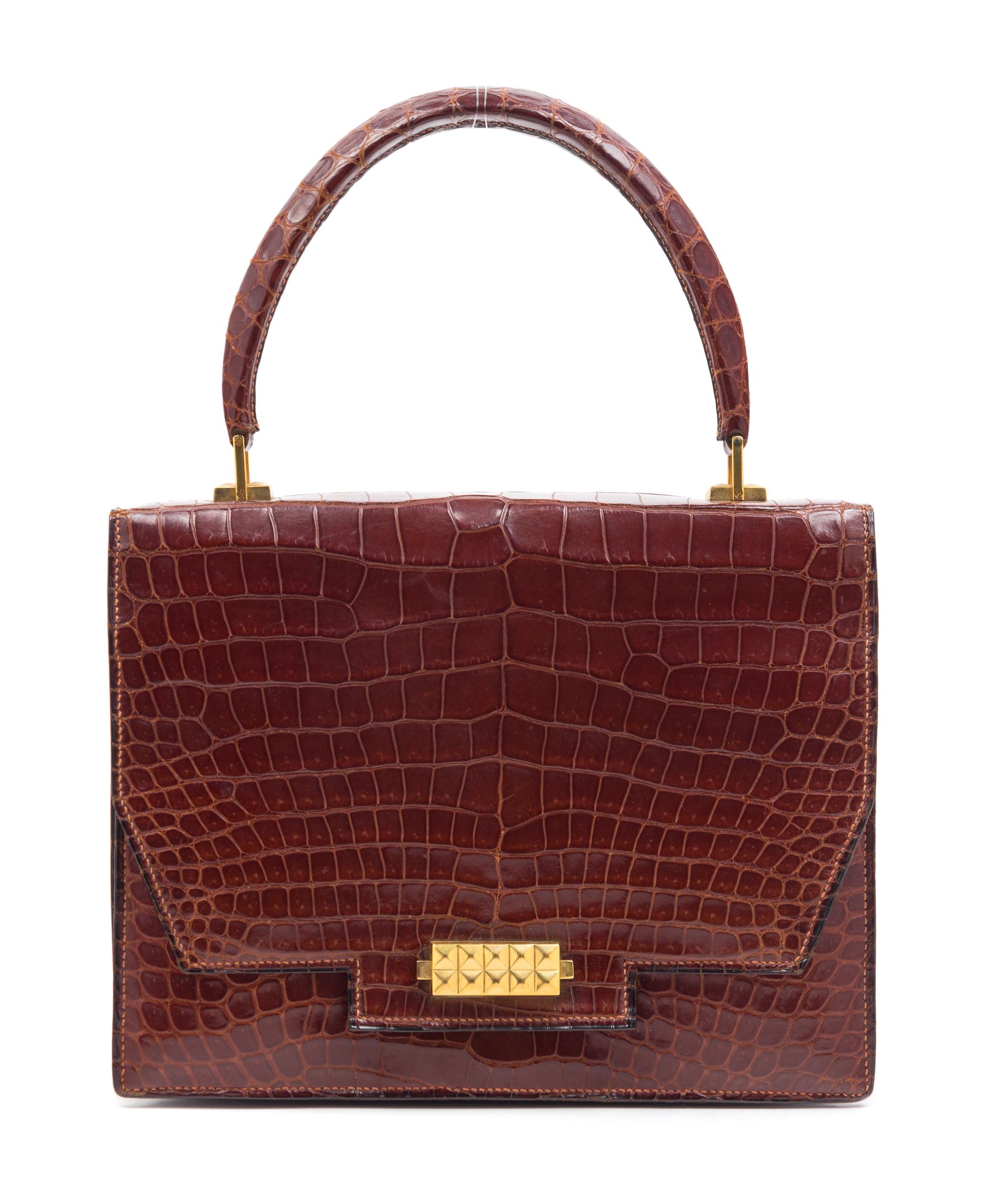An Hermes Brown Crocodile Handbag, 9.5" x 7.5" x 1.5".