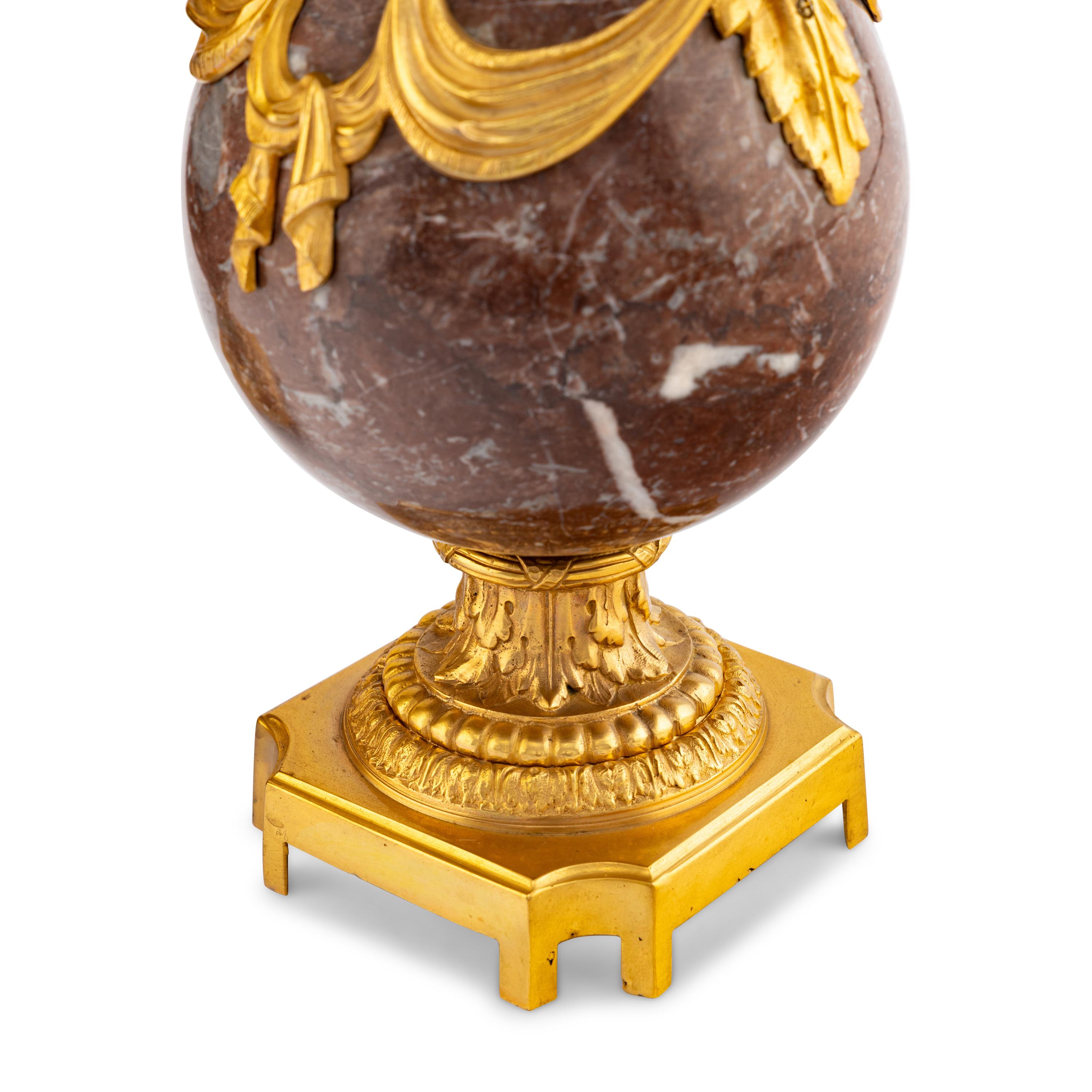 A Pair of Louis XVI Style Gilt Bronze Mounted Marble Urns