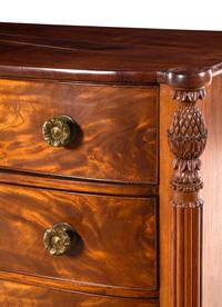 A Federal Carved and Figured Mahogany Bow-Front Chest of Drawers