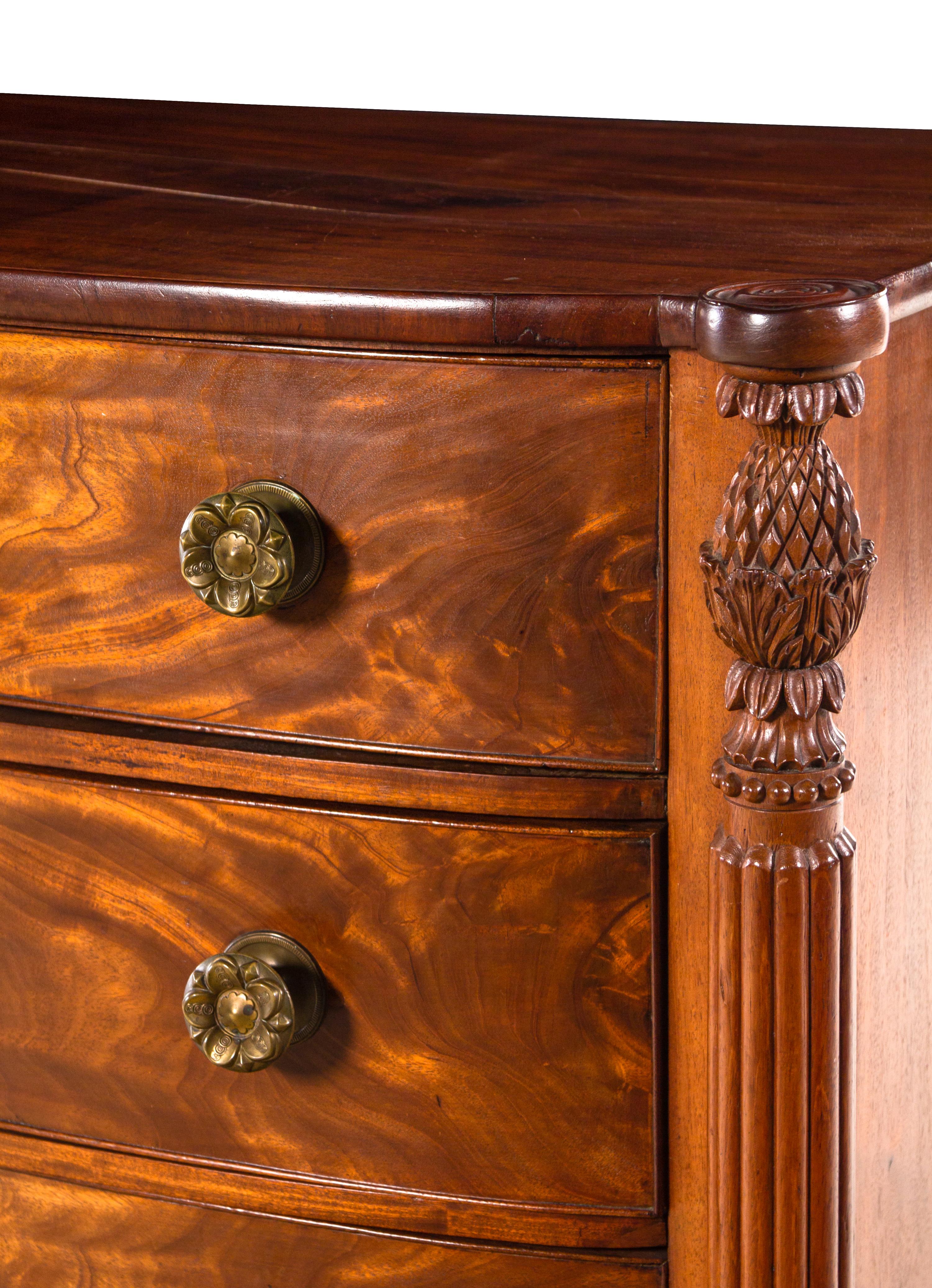 A Federal Carved and Figured Mahogany Bow-Front Chest of Drawers