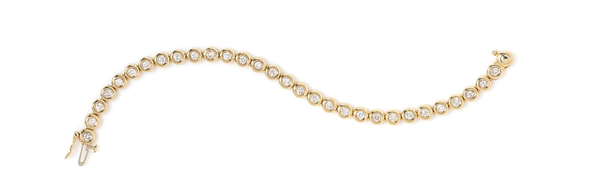 A 14 Karat Yellow Gold and Diamond Line Bracelet, 7.50 dwts.