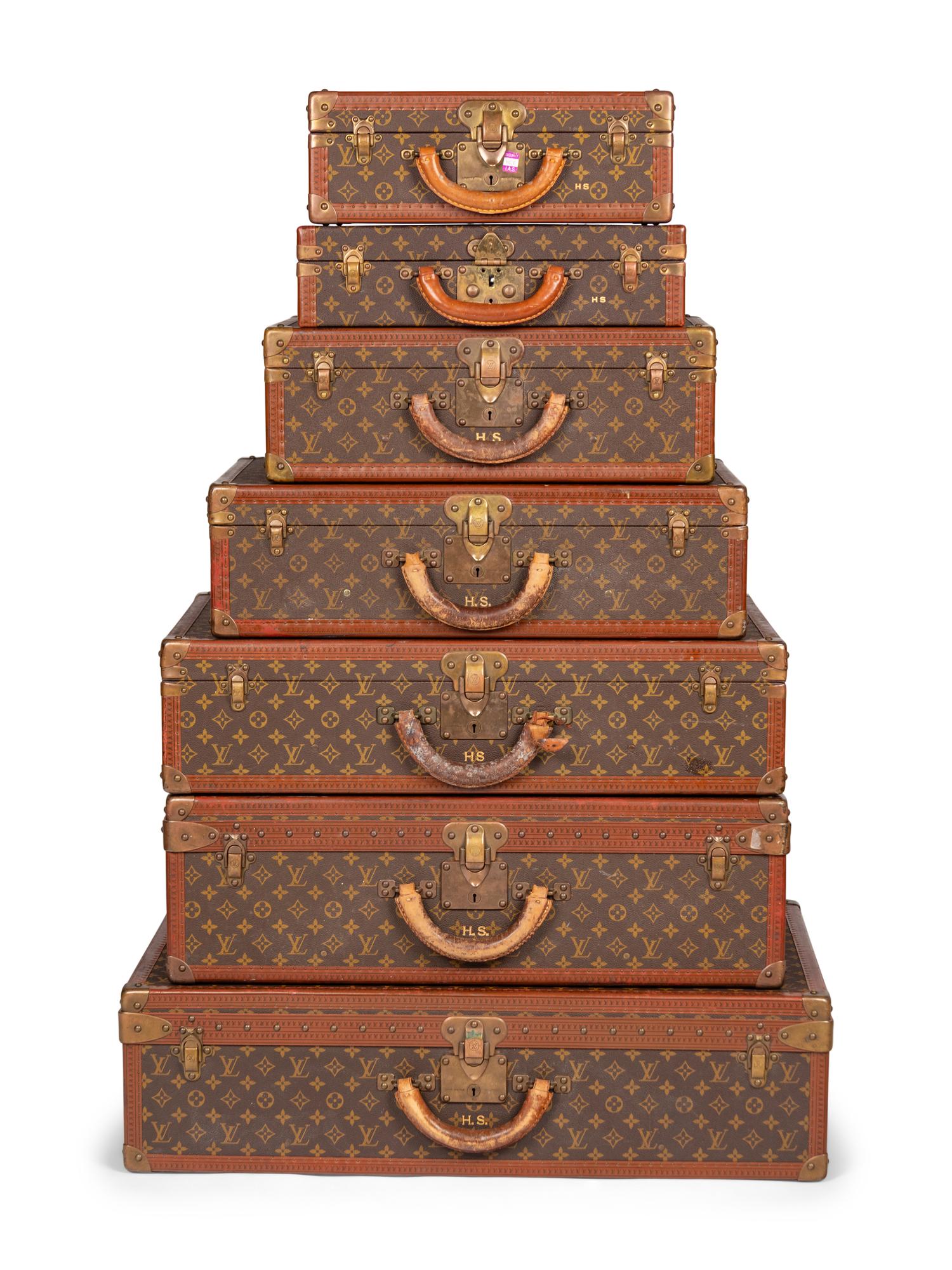 A Group of Seven Louis Vuitton Hardside Suitcases