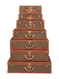 A Group of Seven Louis Vuitton Hardside Suitcases