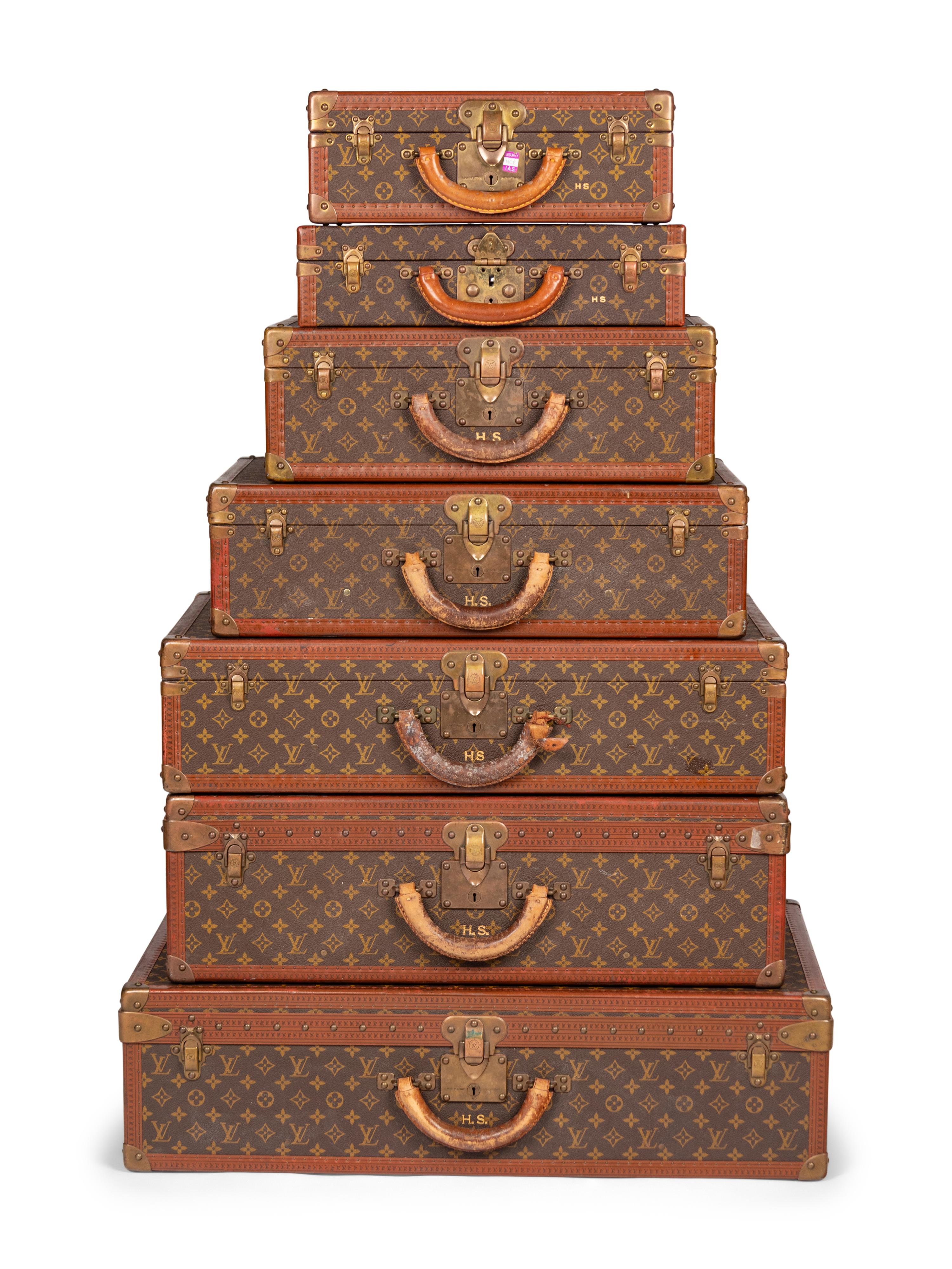 A Group of Seven Louis Vuitton Hardside Suitcases