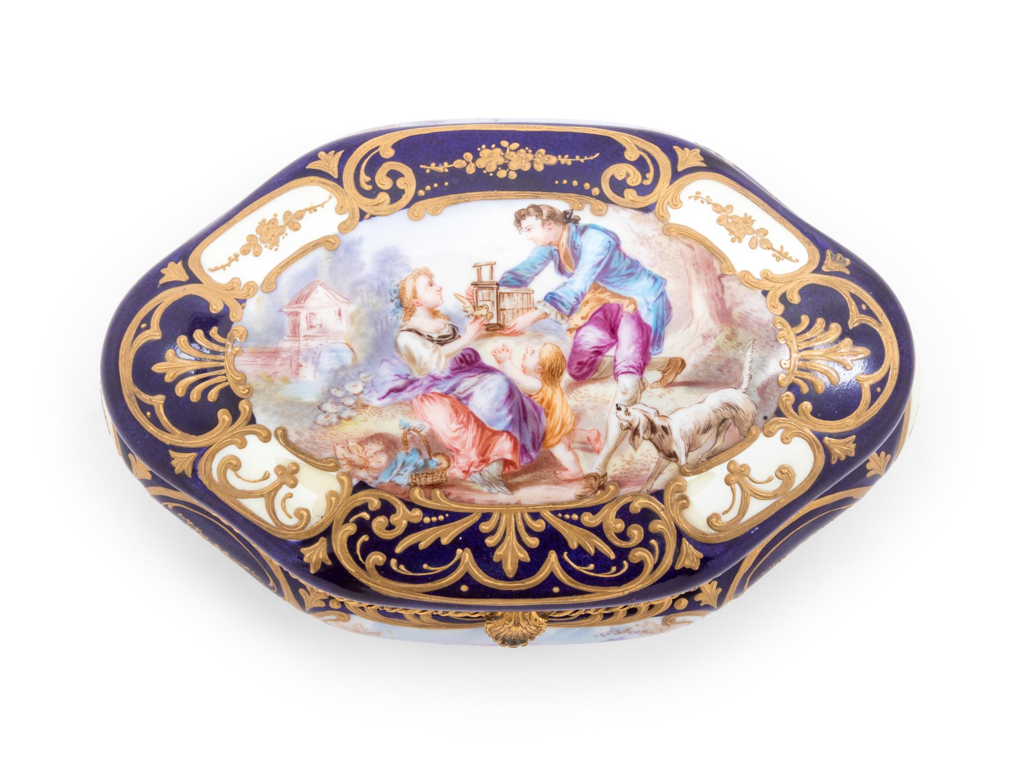 A Sèvres Style Painted and Parcel Gilt Porcelain Table Casket