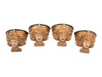 A Set of Four Italian Carved, Painted and Parcel Gilt Wall Brackets