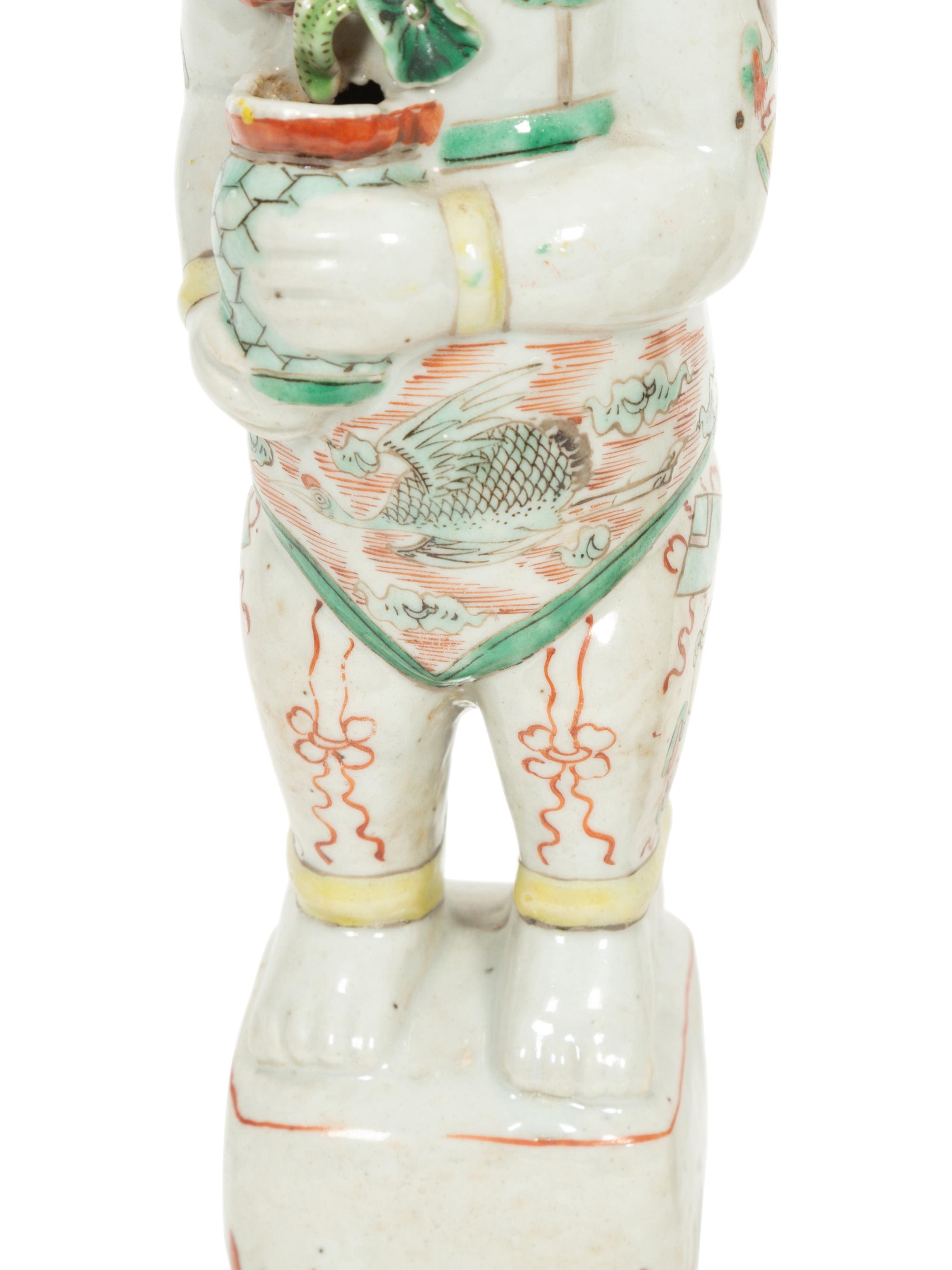 A Pair of Chinese Porcelain Figures of Boys