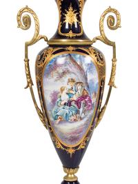 A Pair of Sèvres Style Gilt Metal Mounted Porcelain Covered Urns
