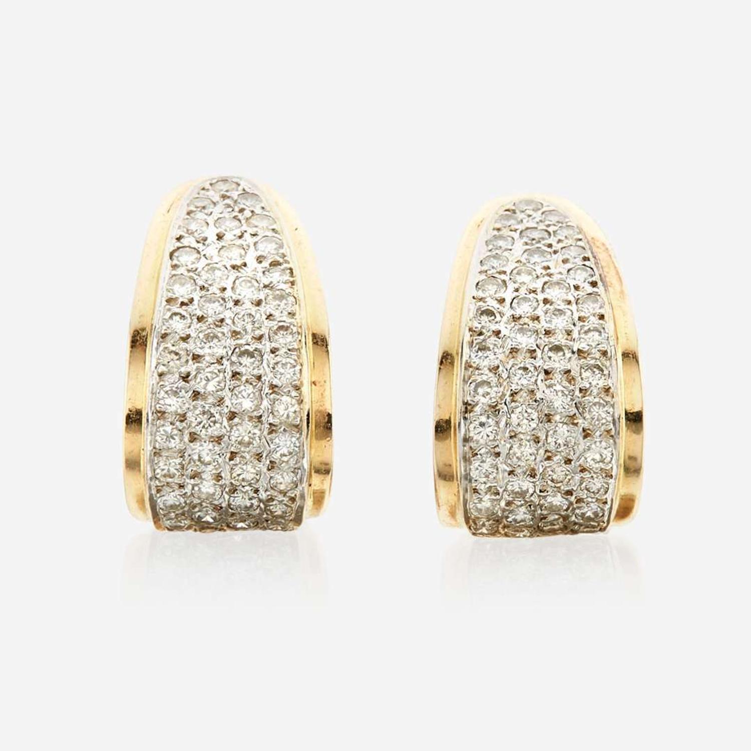 A pair of diamond and gold earrings