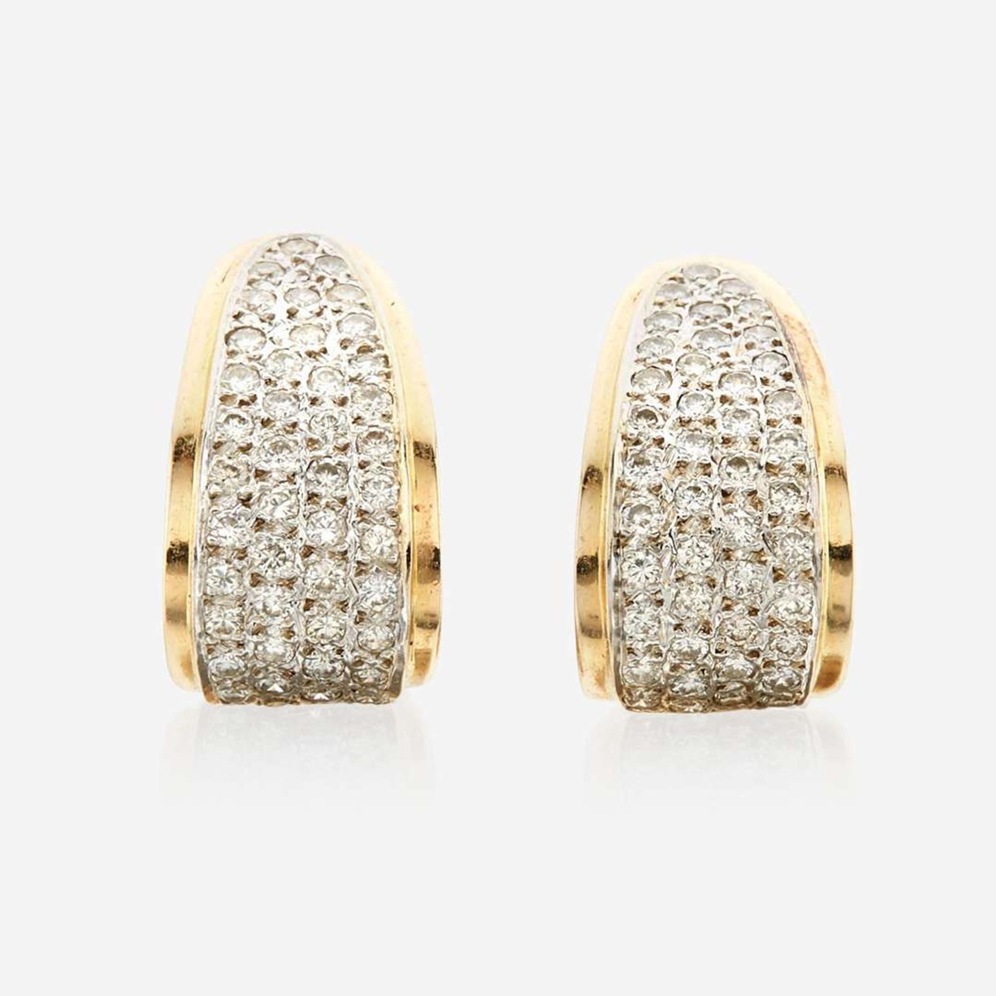 A pair of diamond and gold earrings
