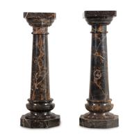 A Pair of Carved Marble Pedestals