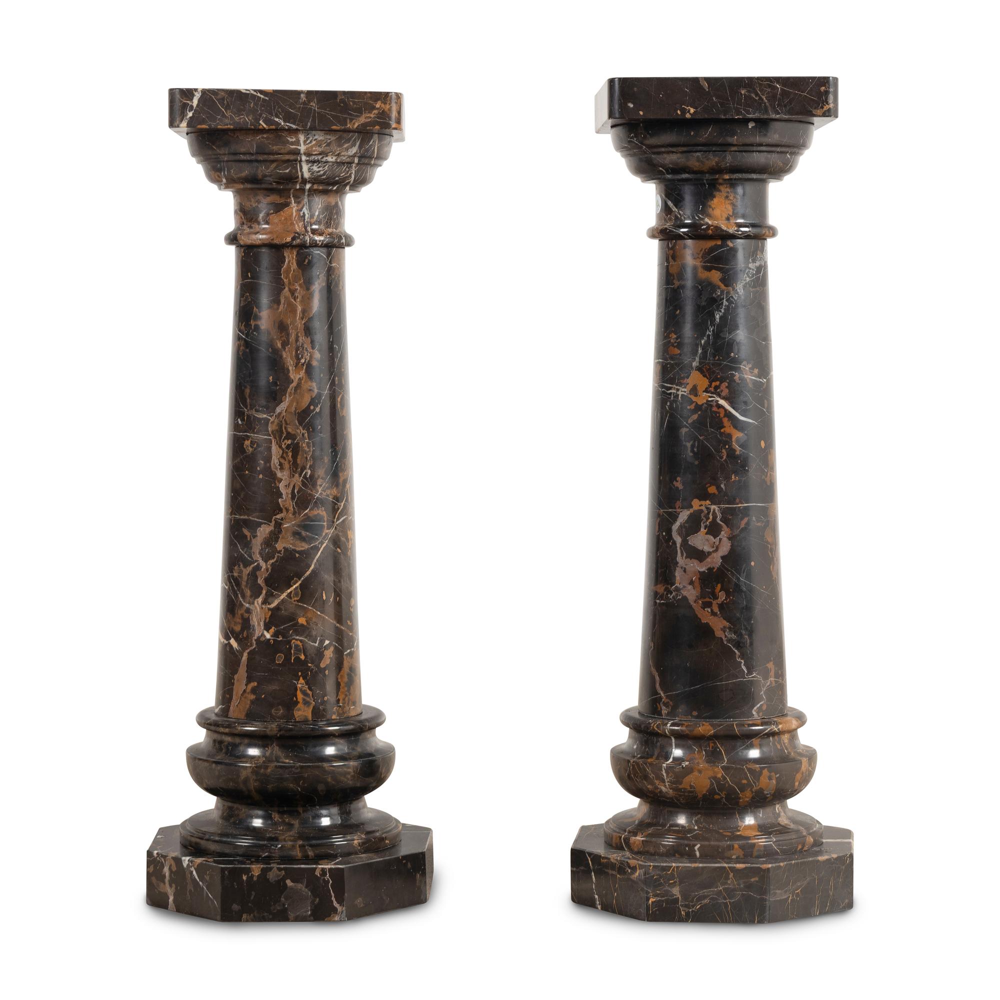 A Pair of Carved Marble Pedestals