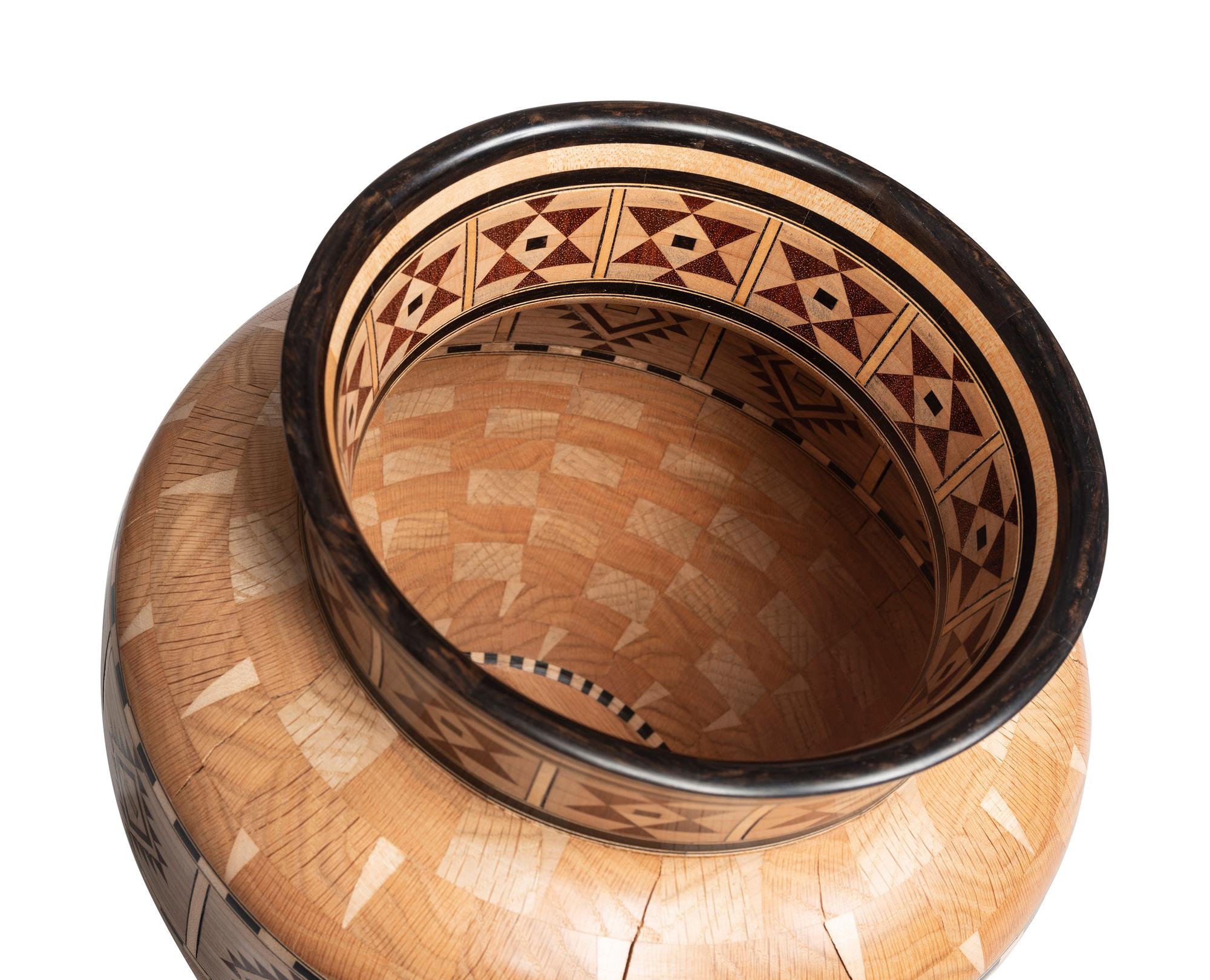 A Turned and Segmented Wood Vase in the style of Ray Allen