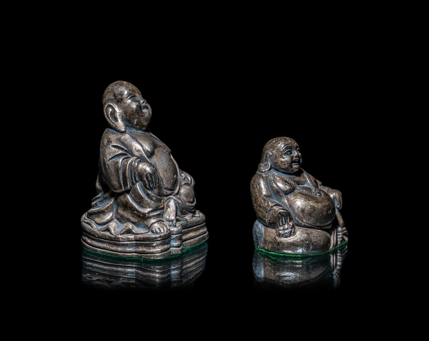 Two Silver Figures of Laughing Buddha