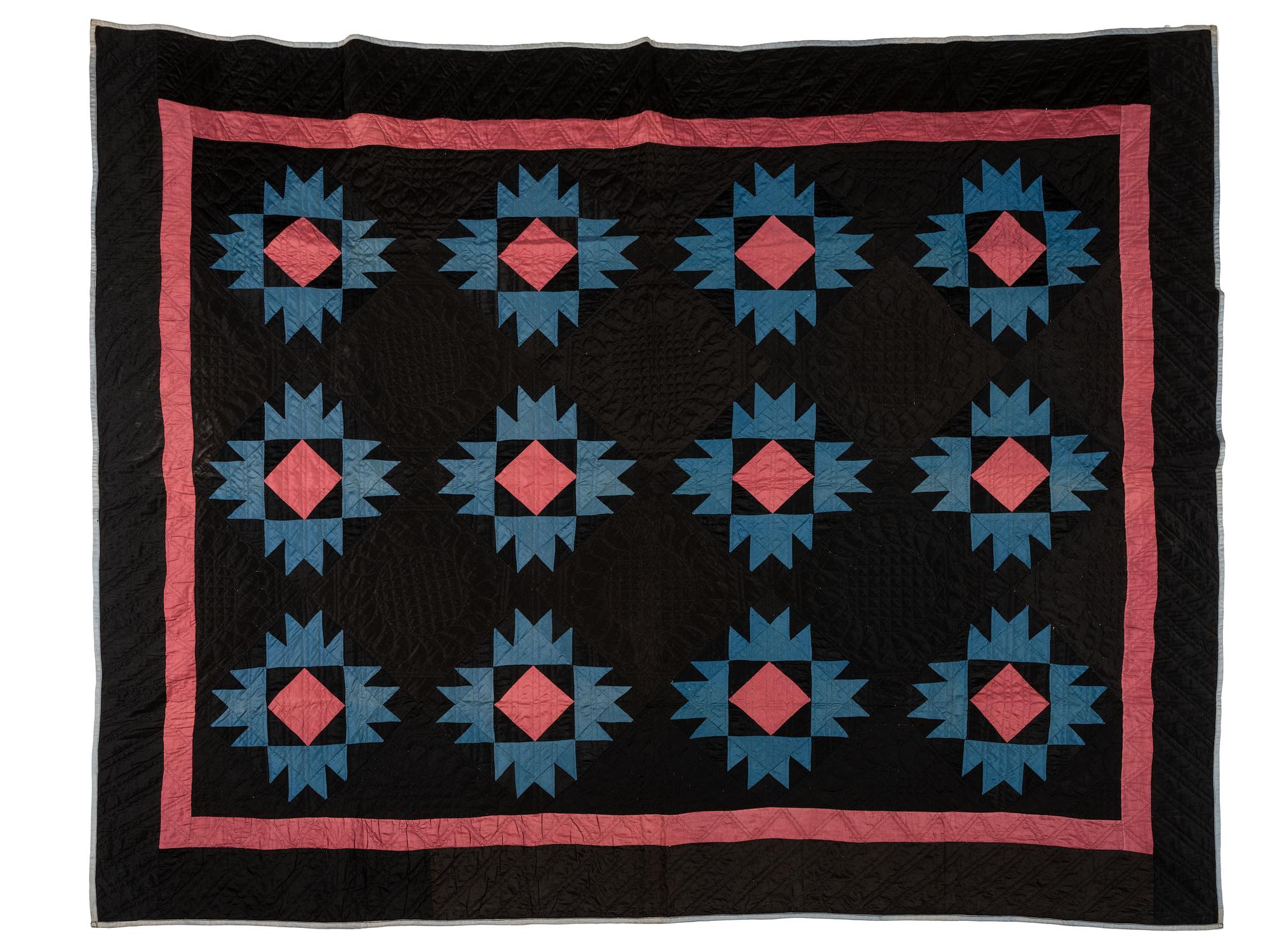 A Black, Blue and Red Star-Pattern Pieced Cotton Quilt