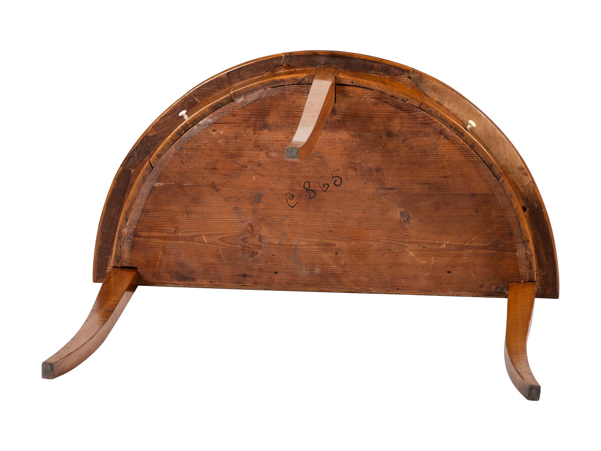 A Biedermeier Figured Birch Demilune Table