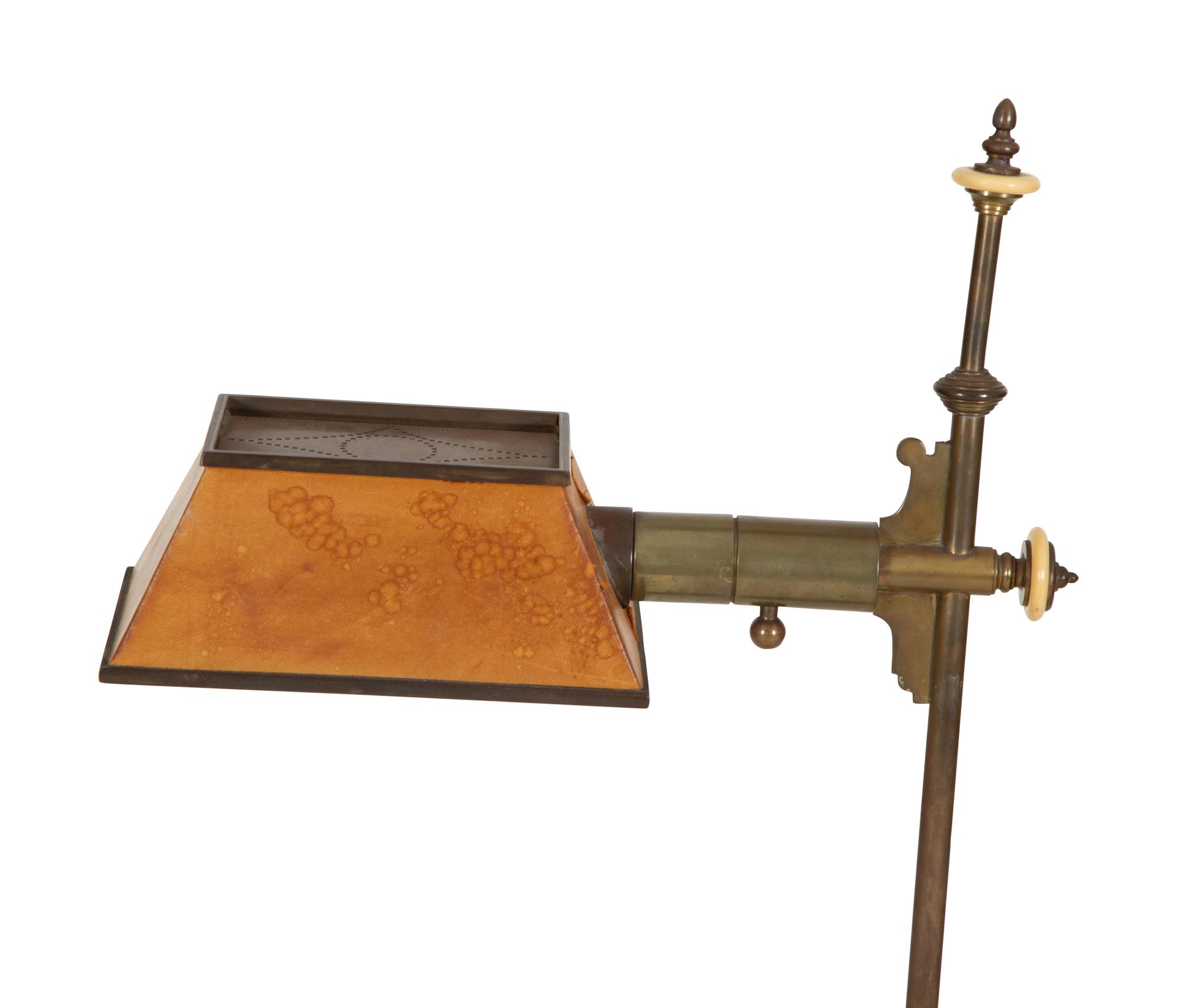 An Arts and Crafts Style Brass Floor Lamp with Tole Shade — Early 20th Century