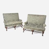 A pair of Queen Anne style walnut settees with silk damask upholstery late 19th / early 20th century