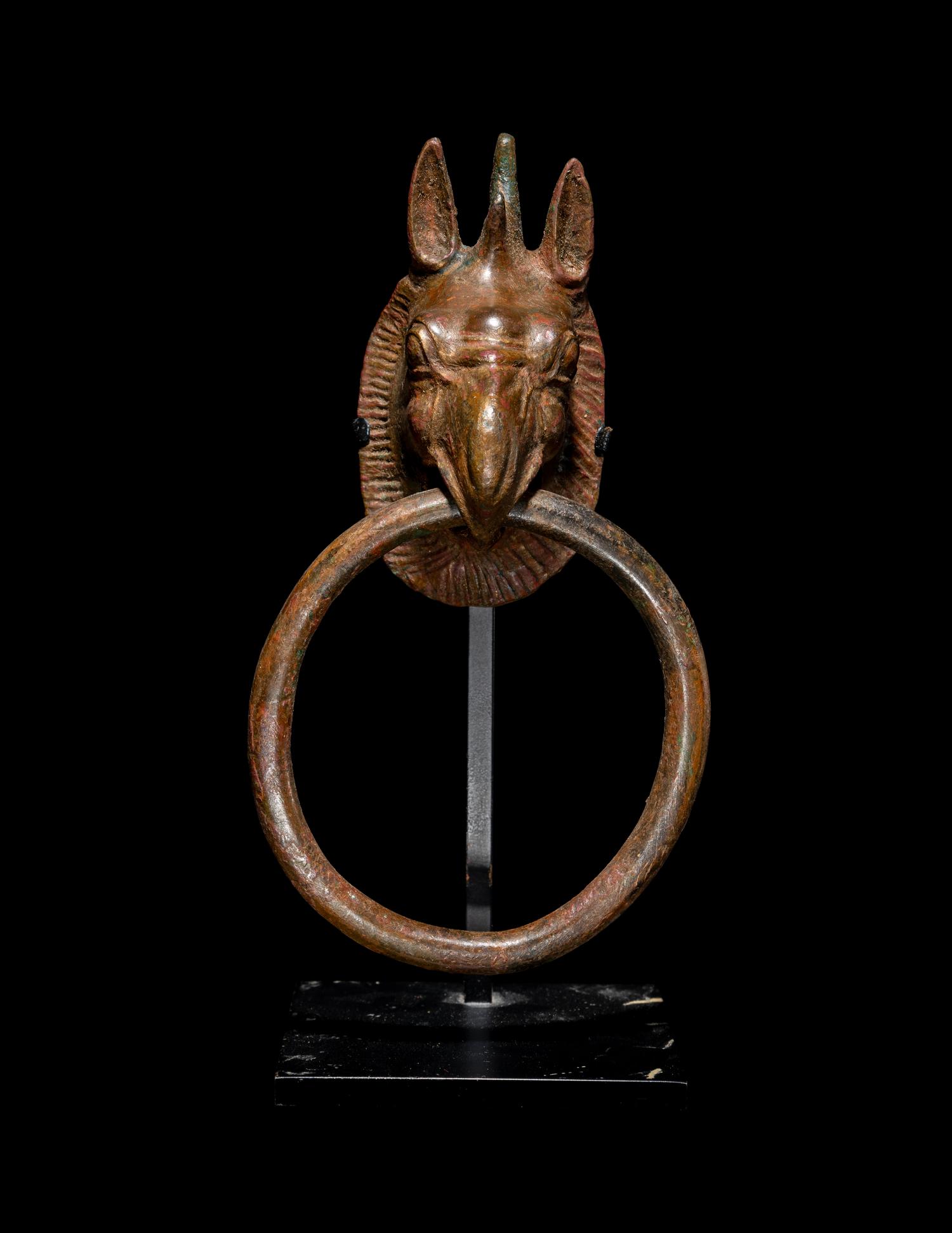 A Greek Bronze Handle with a Griffin Head