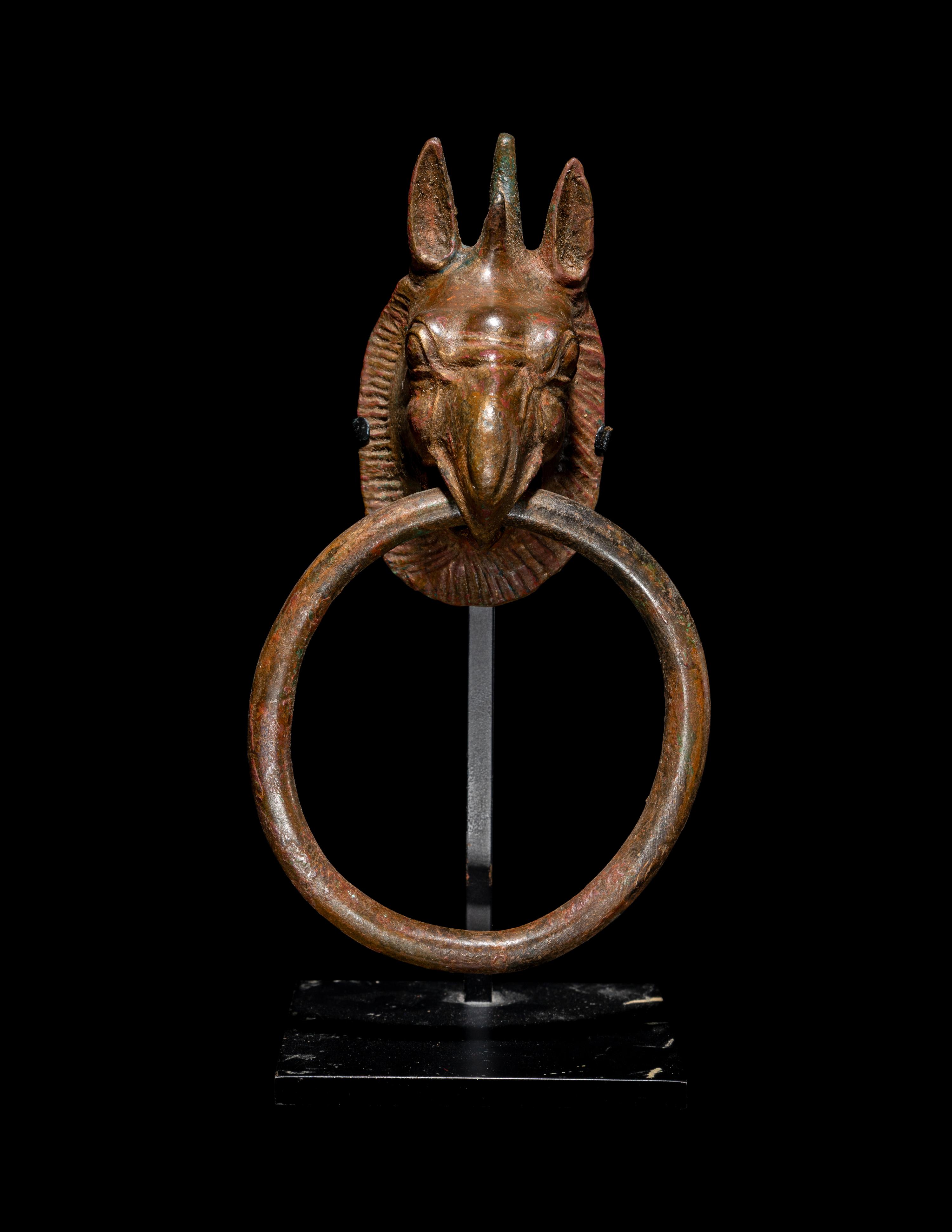 A Greek Bronze Handle with a Griffin Head