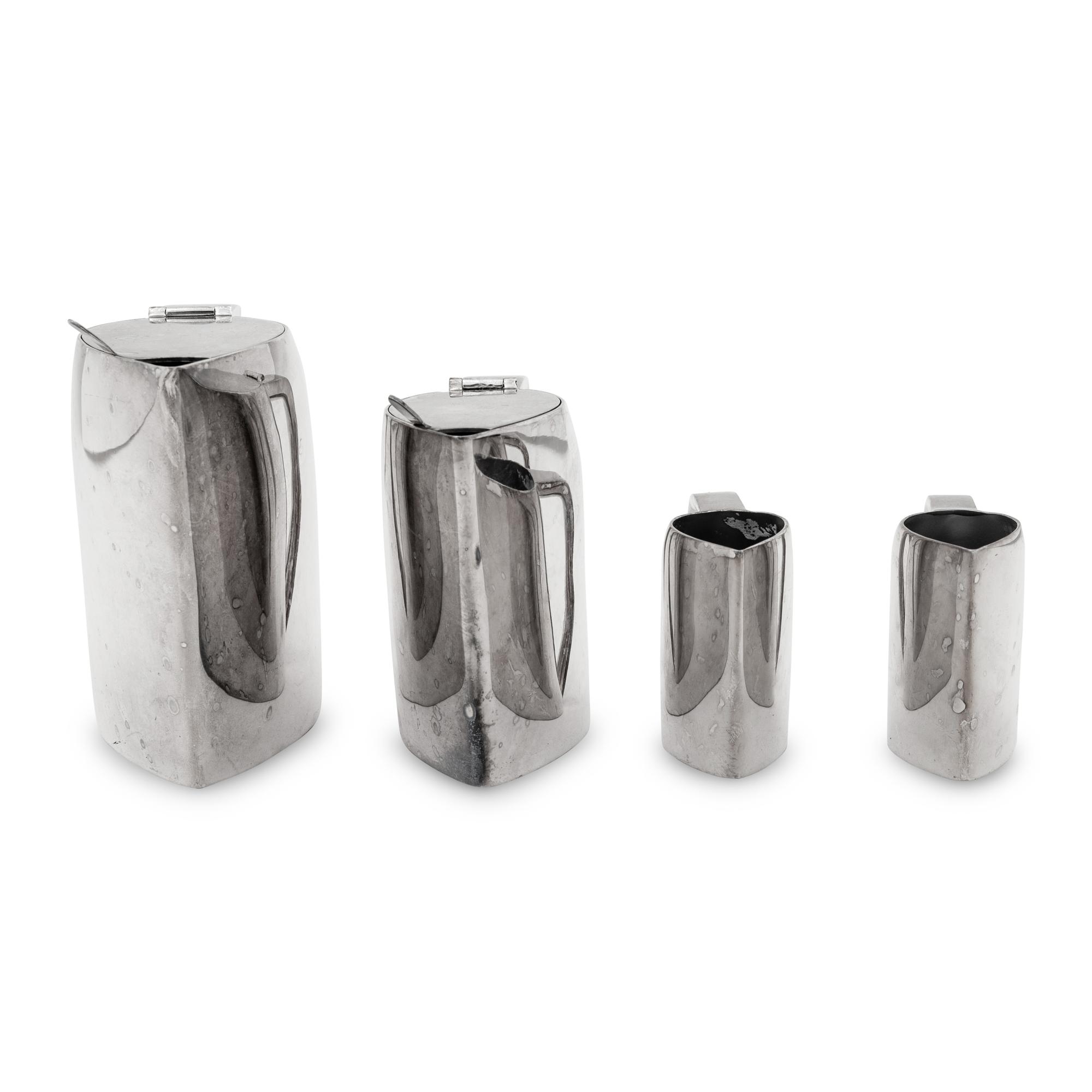 A Group of Four Ercuis Silver-Plate Milk or Cream Pitchers