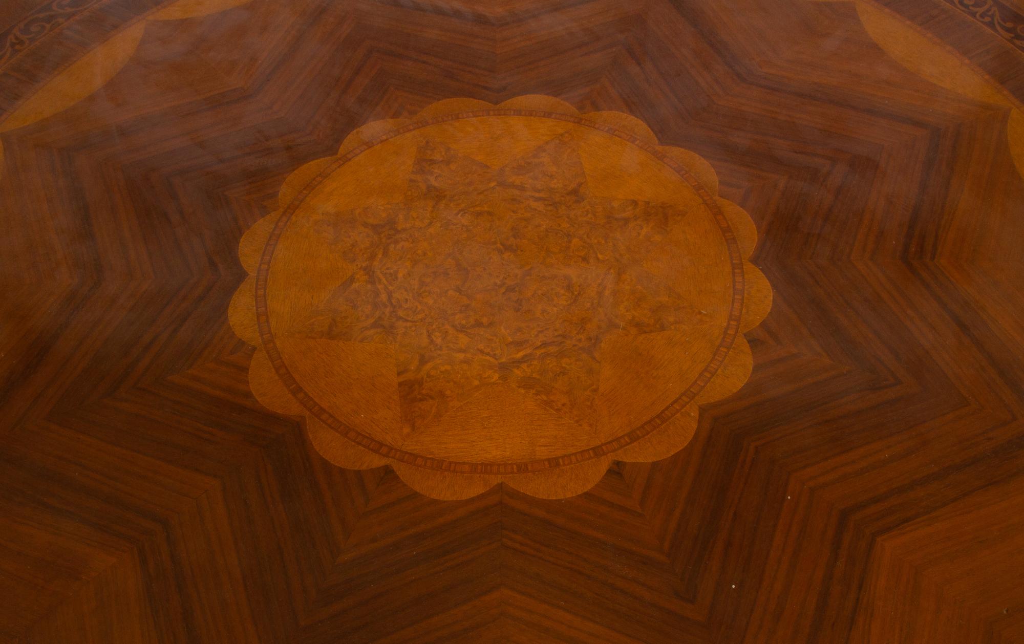 An Empire Style Inlaid Beechwood and Parcel Gilt Center Table by Hurtado