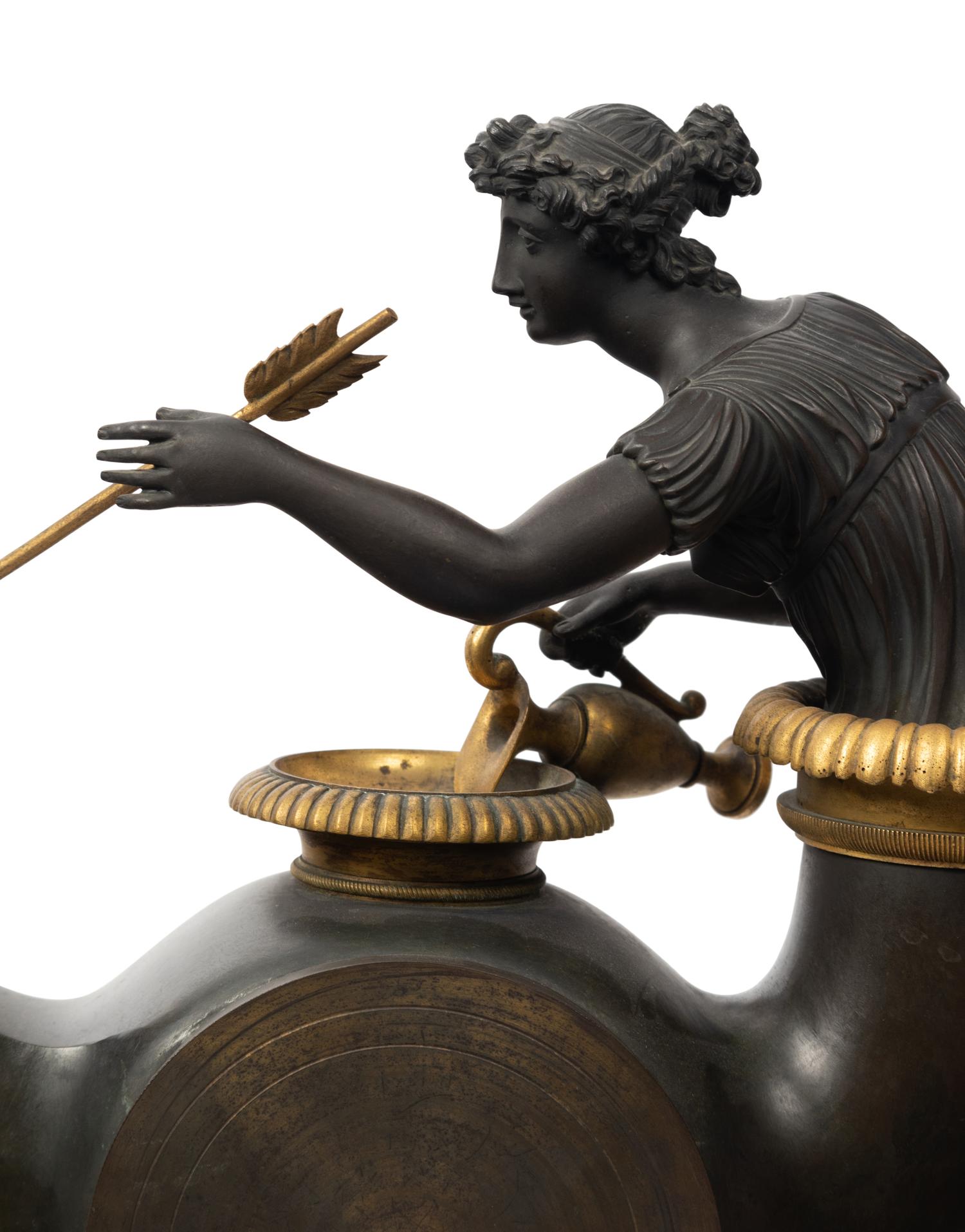 A French Neoclassical Gilt and Patinated Bronze "Oil Lamp" Clock