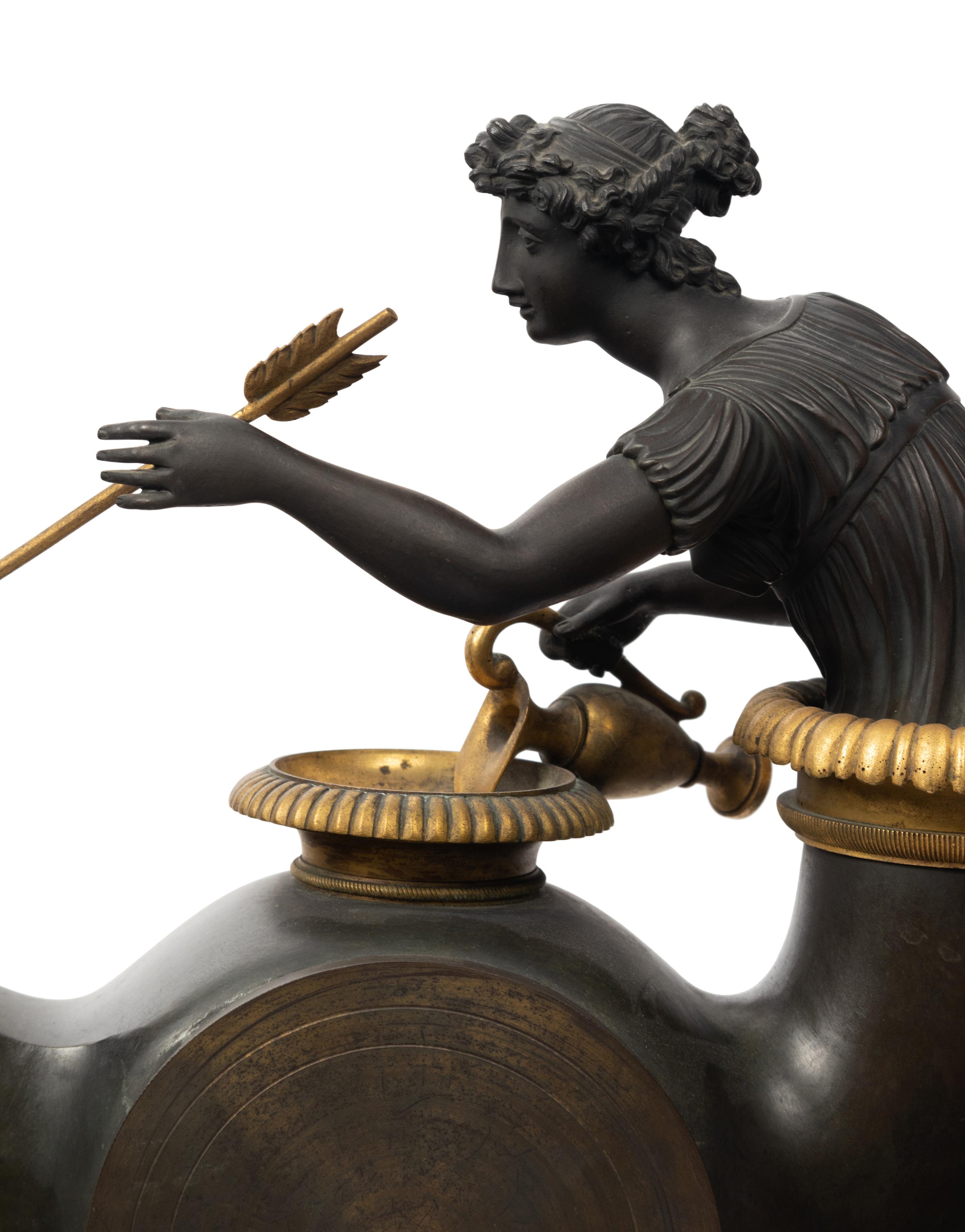 A French Neoclassical Gilt and Patinated Bronze "Oil Lamp" Clock