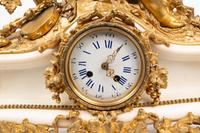 An Assembled French Gilt Bronze Mounted Marble Three-Piece Clock Garniture