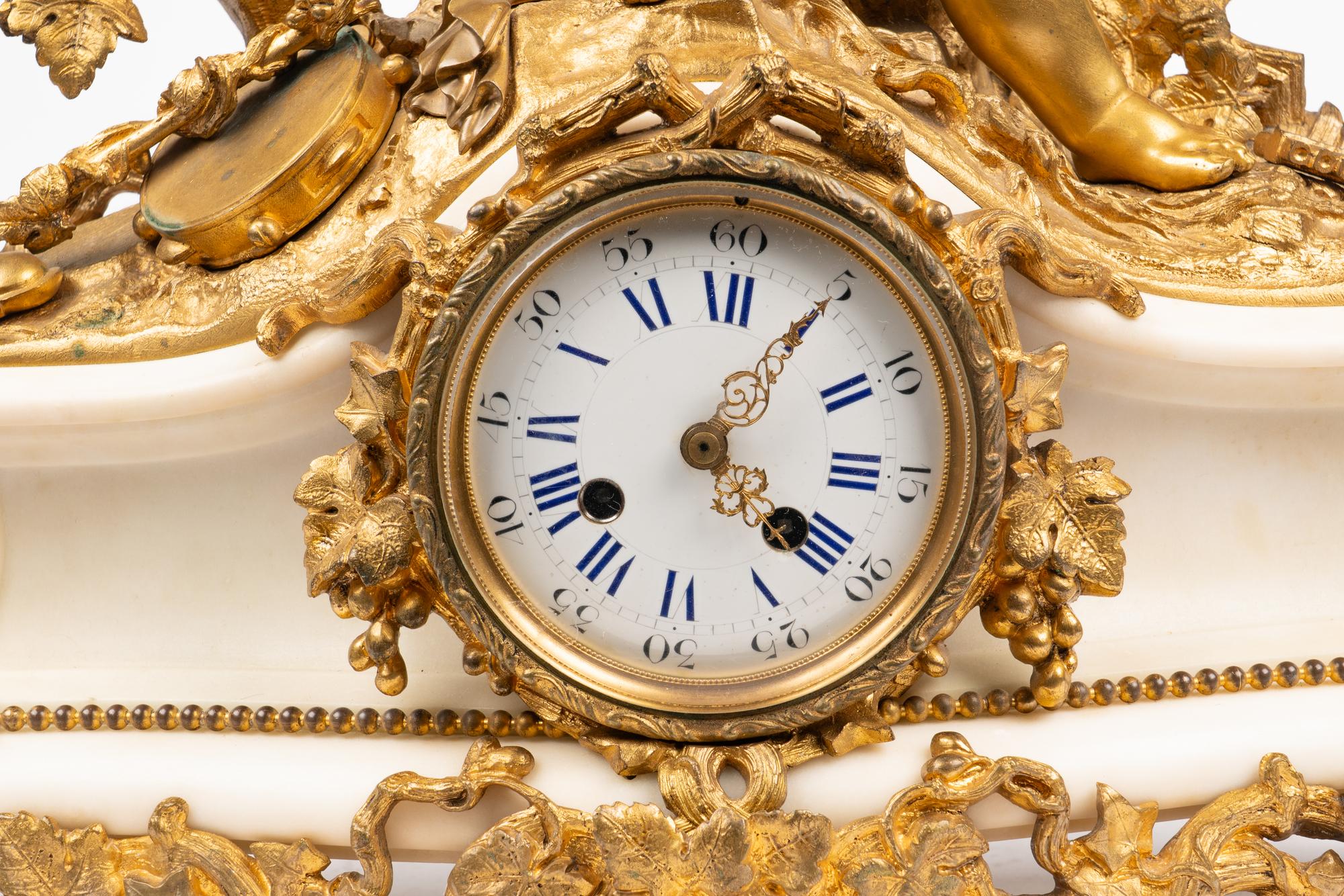 An Assembled French Gilt Bronze Mounted Marble Three-Piece Clock Garniture