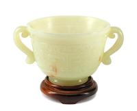 A Chinese Carved Jadeite Cup on a Wood Base
