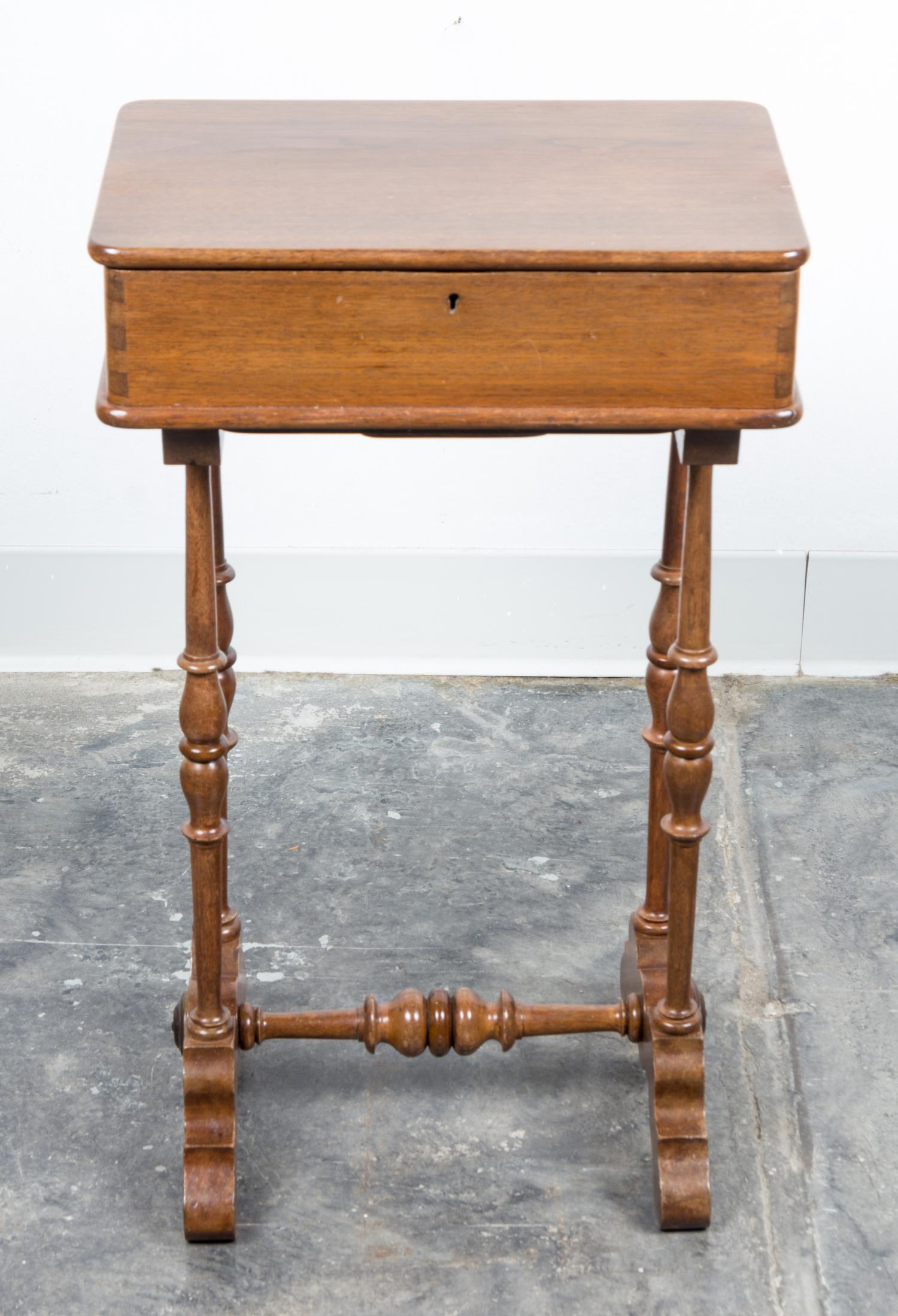 A Walnut Work Table Height 24 x width 14 1/2 x depth 9 3/4 inches.